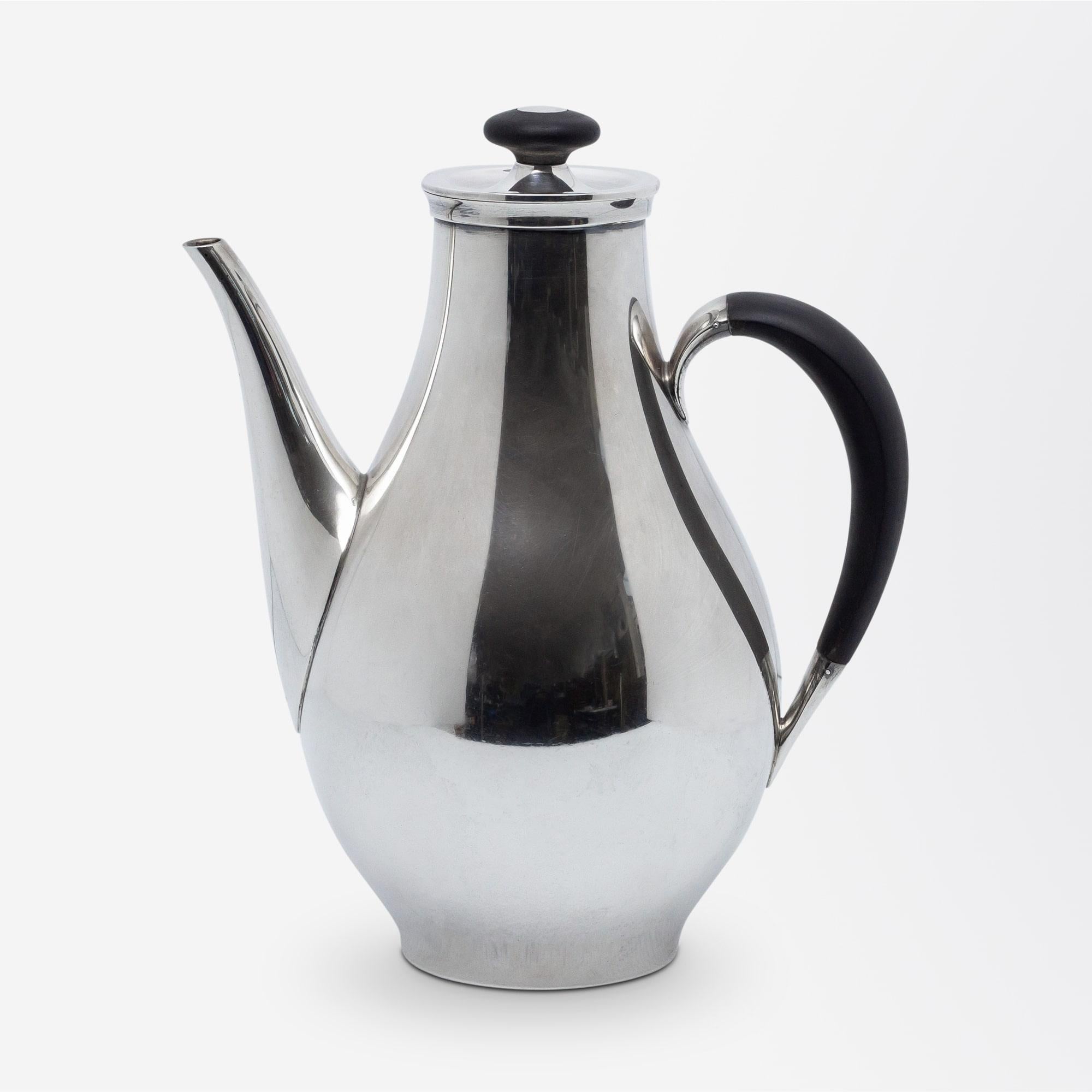 A three-piece coffee set in sterling silver and ebony by American maker Gorham, circa 1956. The service which was designed by Philip B. Johnson is Gorham's 'Directional' pattern which perfectly demonstrates the influence of biomorphic aesthetics in