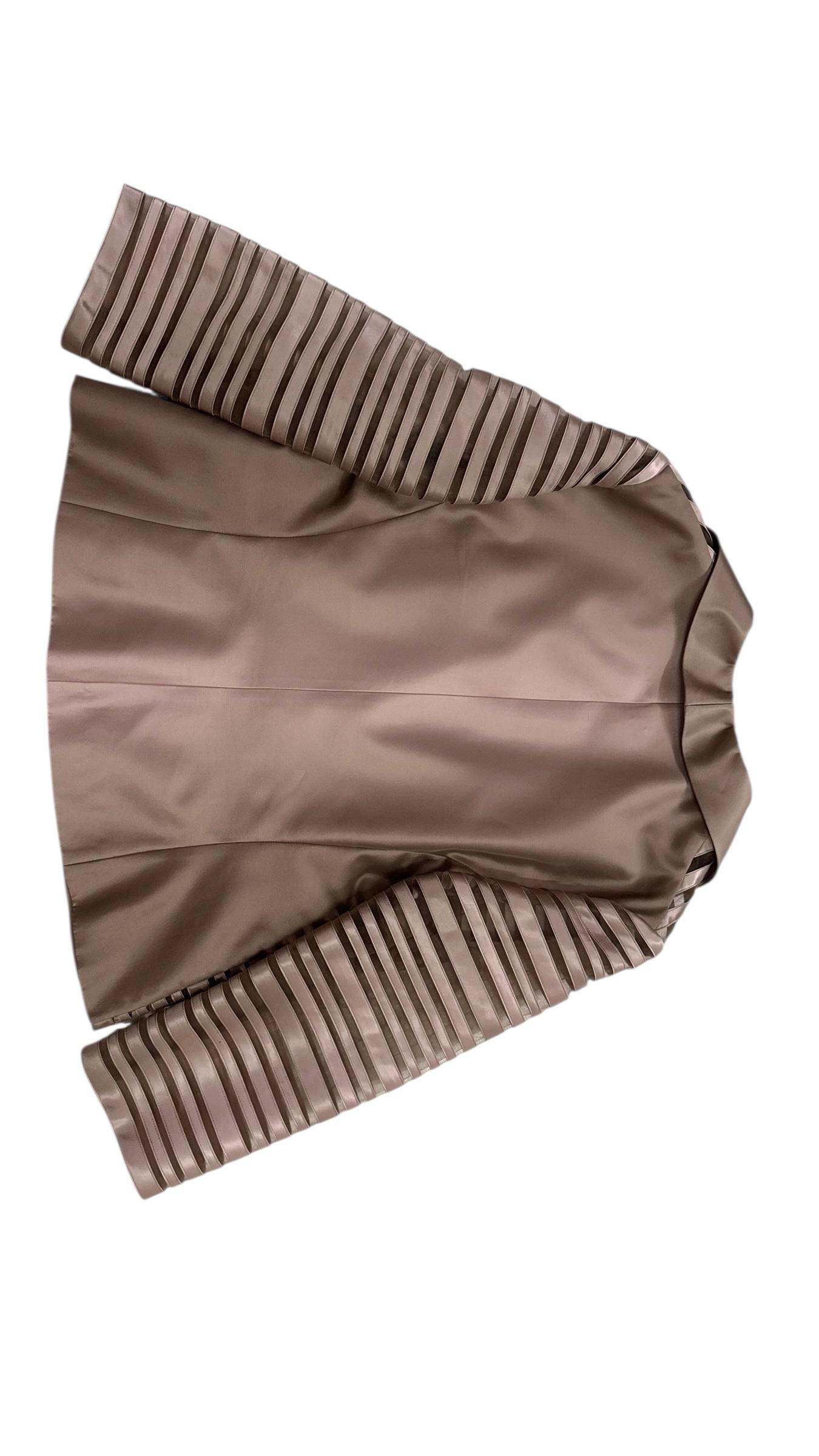 A sophisticated and luminous three-piece ensemble in shimmering champagne silk satin by Elite, likely from the 1990s. This elegant set includes:

A fitted jacket featuring alternating horizontal bands of glossy satin and sheer organza-like fabric,