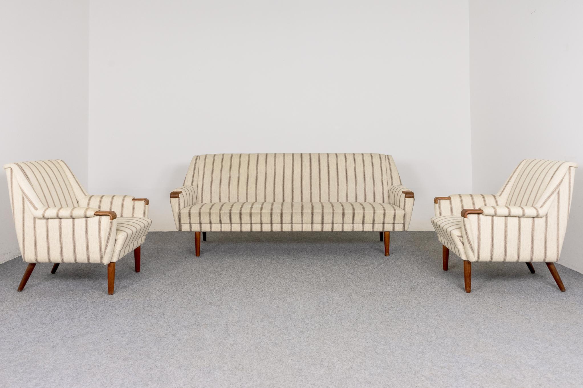 Teak Danish modern three piece set, circa 1960's. Includes, generously sized three seat sofa and two matching loungers. Lovely padded angular arm rests, very comfortable. Original wool striped upholstery, some wear and tear. The solid teak splayed