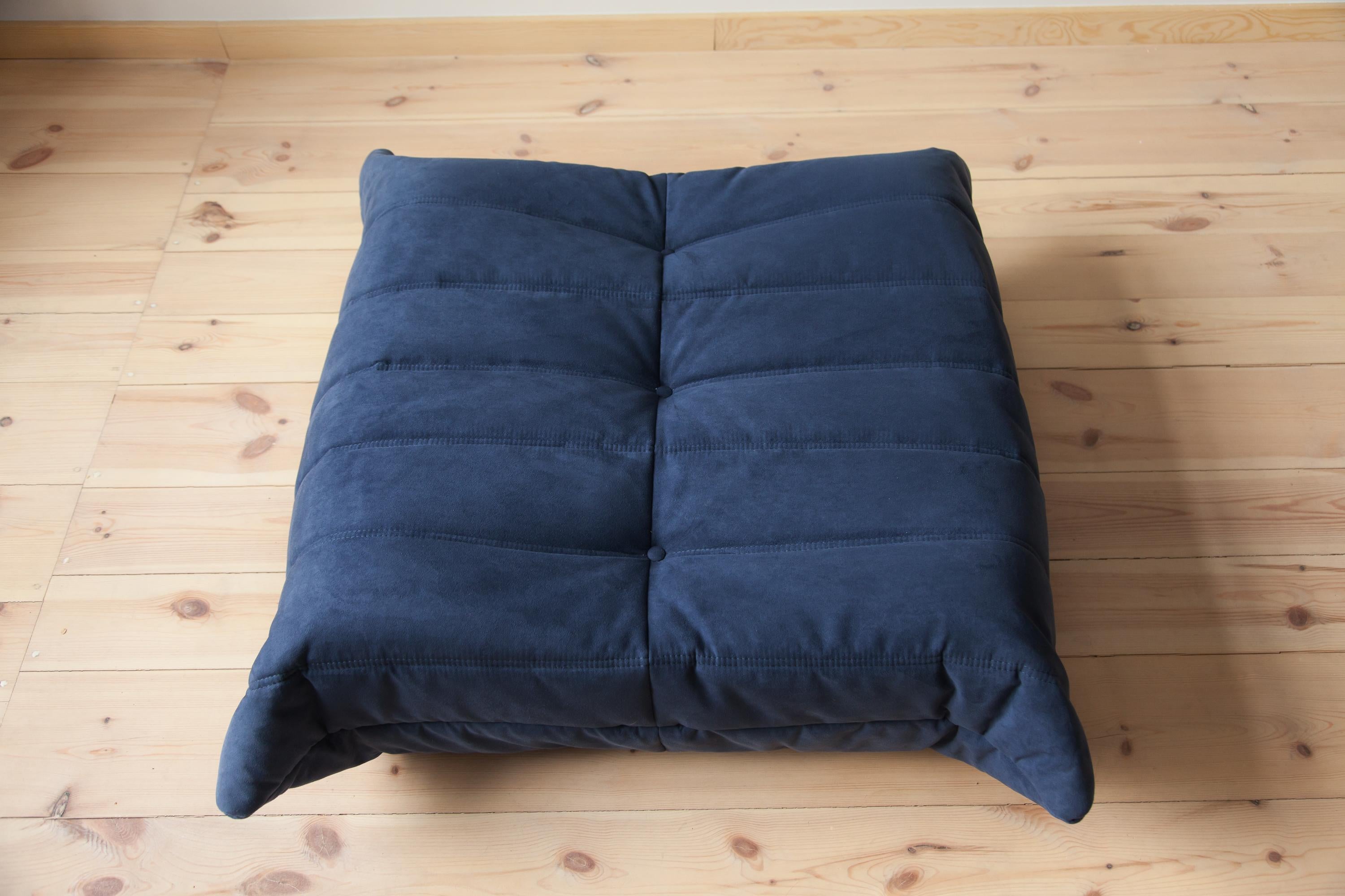 Three-piece Togo living room set was designed by Michel Ducaroy in 1973 and was manufactured by Ligne Roset in France. It has been reupholstered in blue high quality microfiber, and is made up of the following pieces, each with the original Ligne