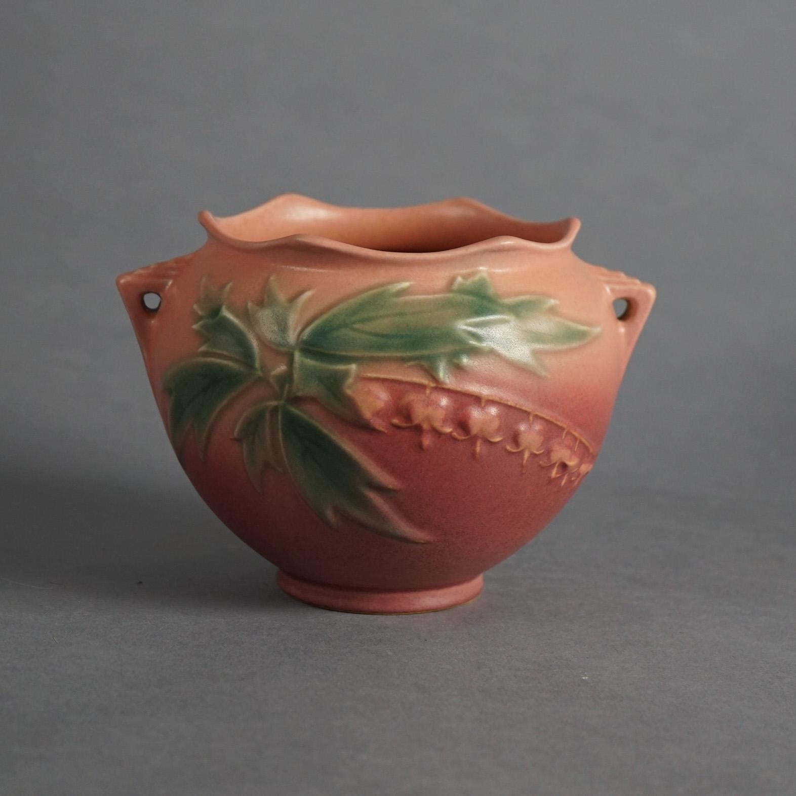 Three Pieces of Pink Roseville Art Pottery with Bleeding Heart Pattern Mid 20thC

Measures - 8