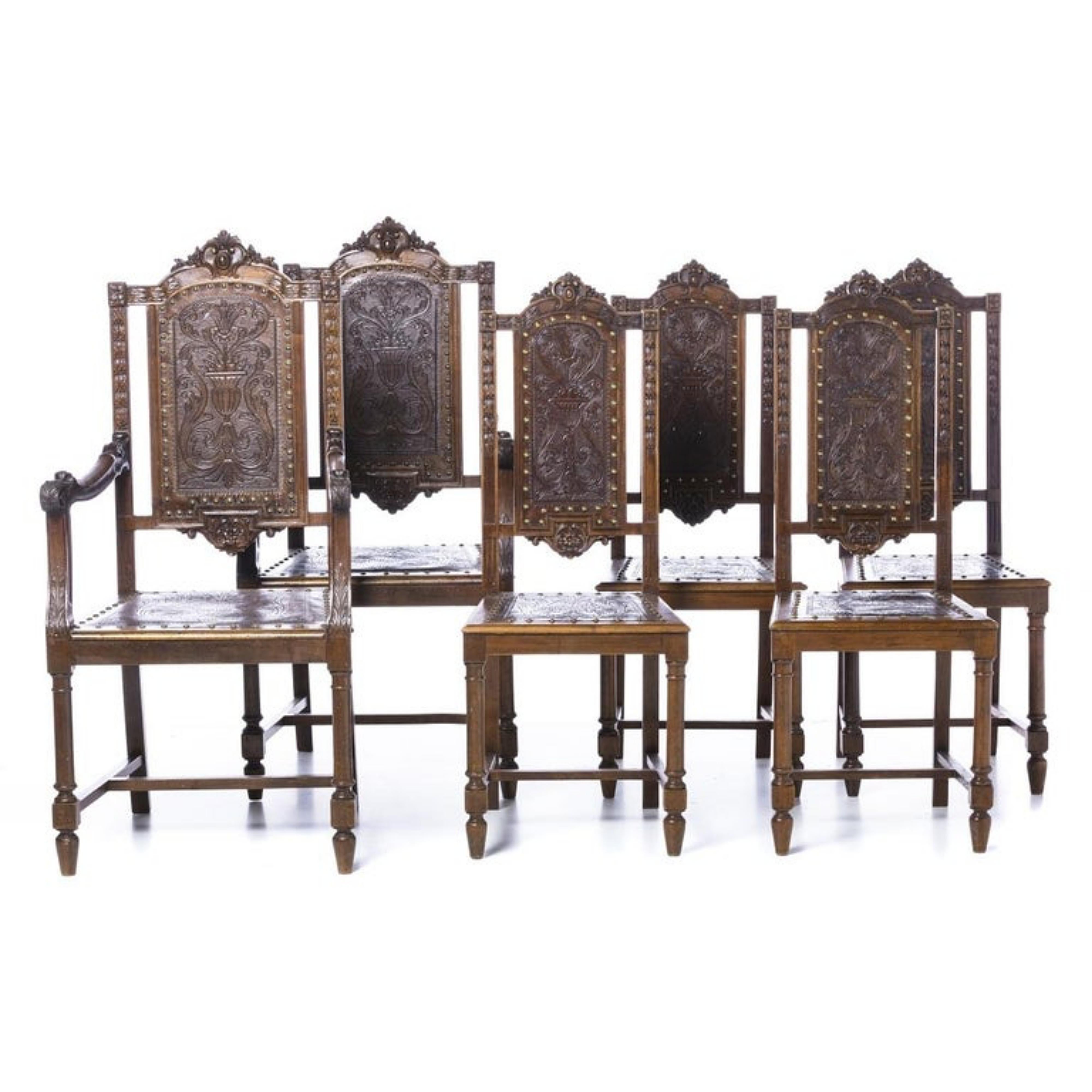 THREE ARMCHAIRS AND SIX CHAIRS

Portuguese,
19th century in carved oak wood, leather seats and back with nailing decorated with plant motifs.
Some defects. 
Dim.: (armchair) 120 x 57.5 x 52 cm.
good condition