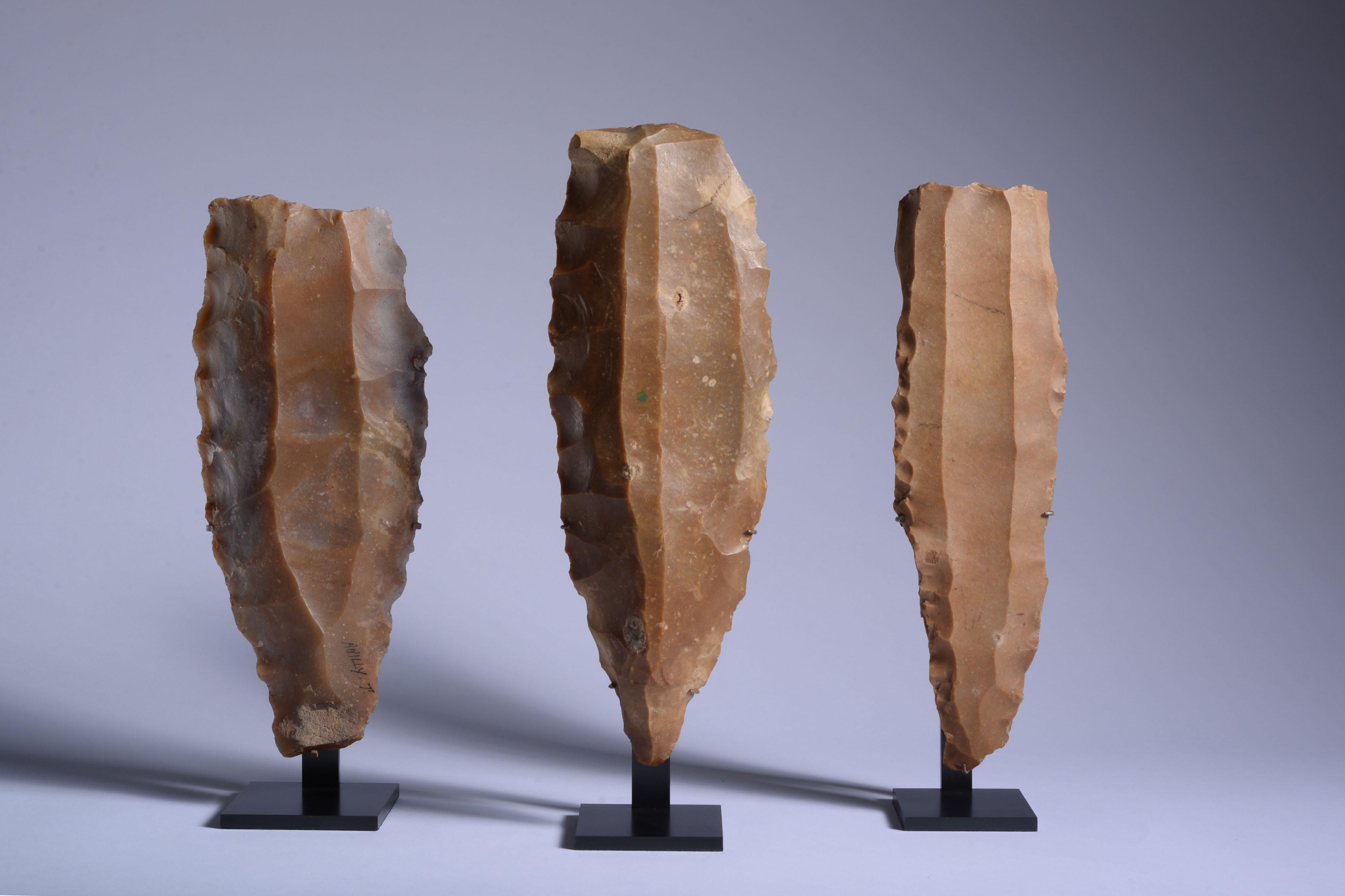 Three Flint cores or 'Livres de Beurre'
Late Neolithic, 3rd millennium B.C.
Flint

With their rugged forms and deep golden-caramel exteriors, these exceptional ‘livres de beurre’ (‘pounds of butter’) represent remarkable artefacts from Late