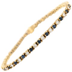 Vintage Three Prong 14 Karat Yellow Gold Sapphire and Diamond Tennis Bracelet