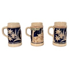 Three quality antique German steins 