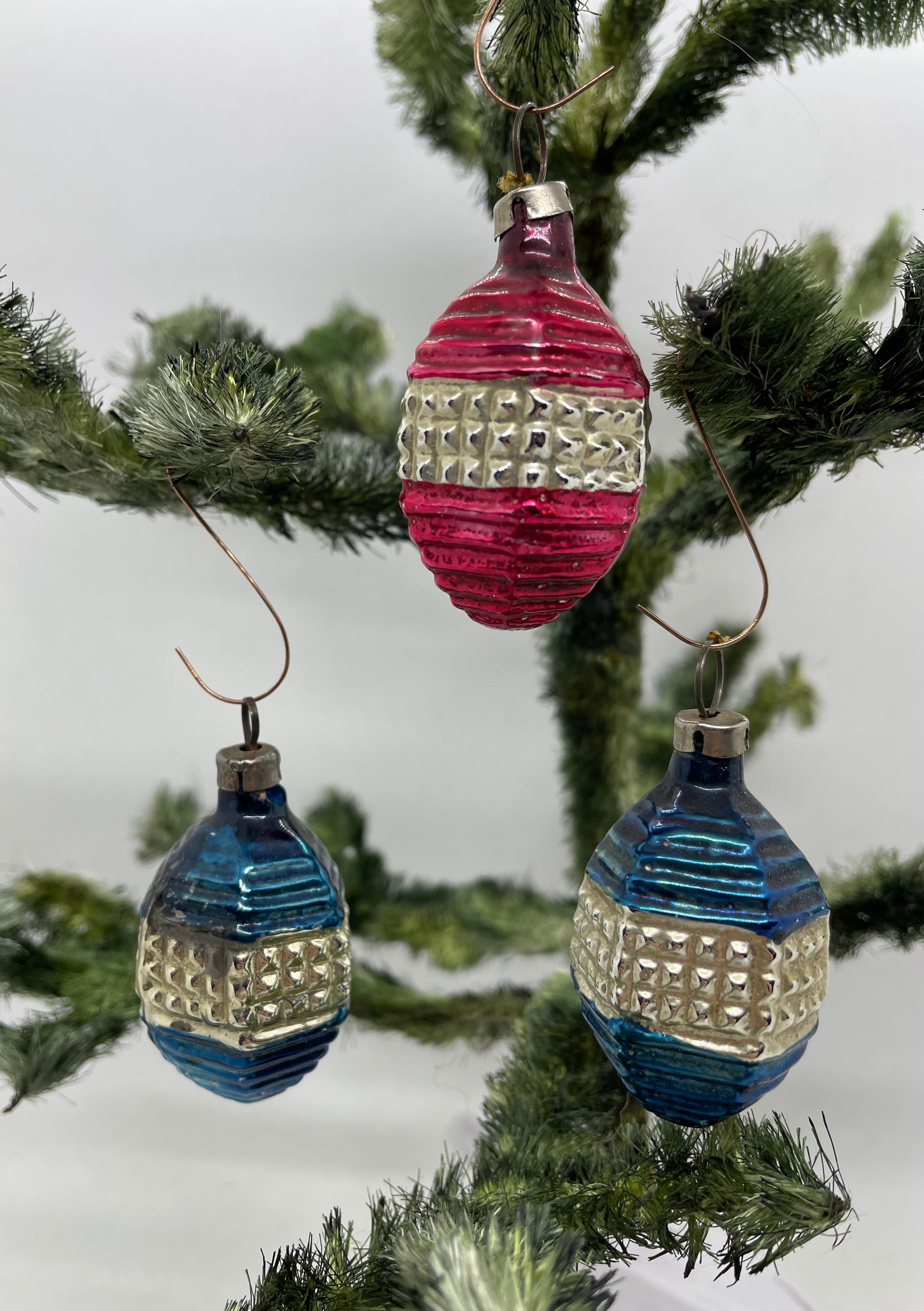 A rare Christmas ornament set of three lampions. Each is made from thin mouth blown glass, this would be a great antique addition for your Christmas or feather tree.
  