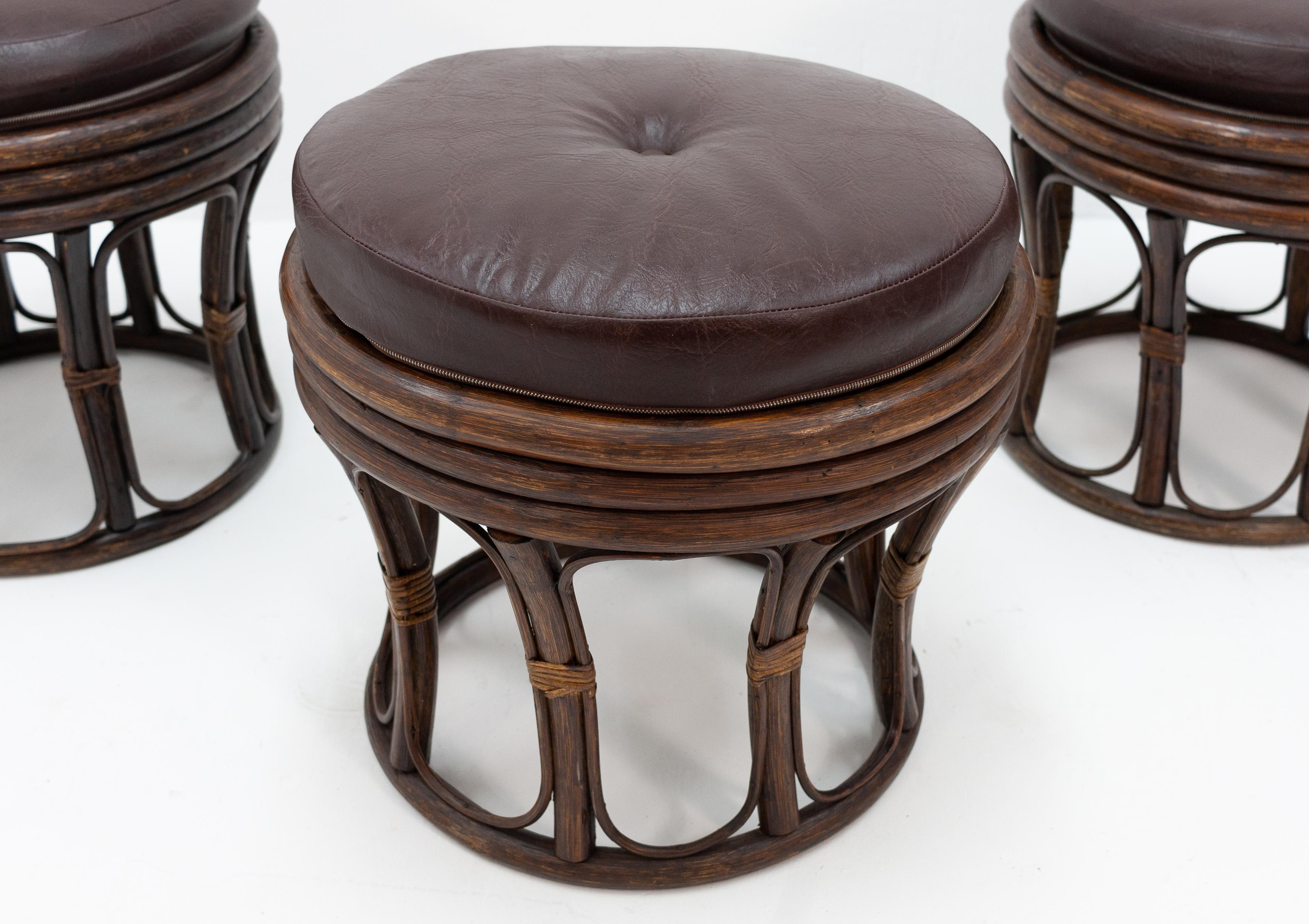 Three identical rattan seating stools .With a faux leather upholstery, brown color. Nice and very useful
stools, 1970s.