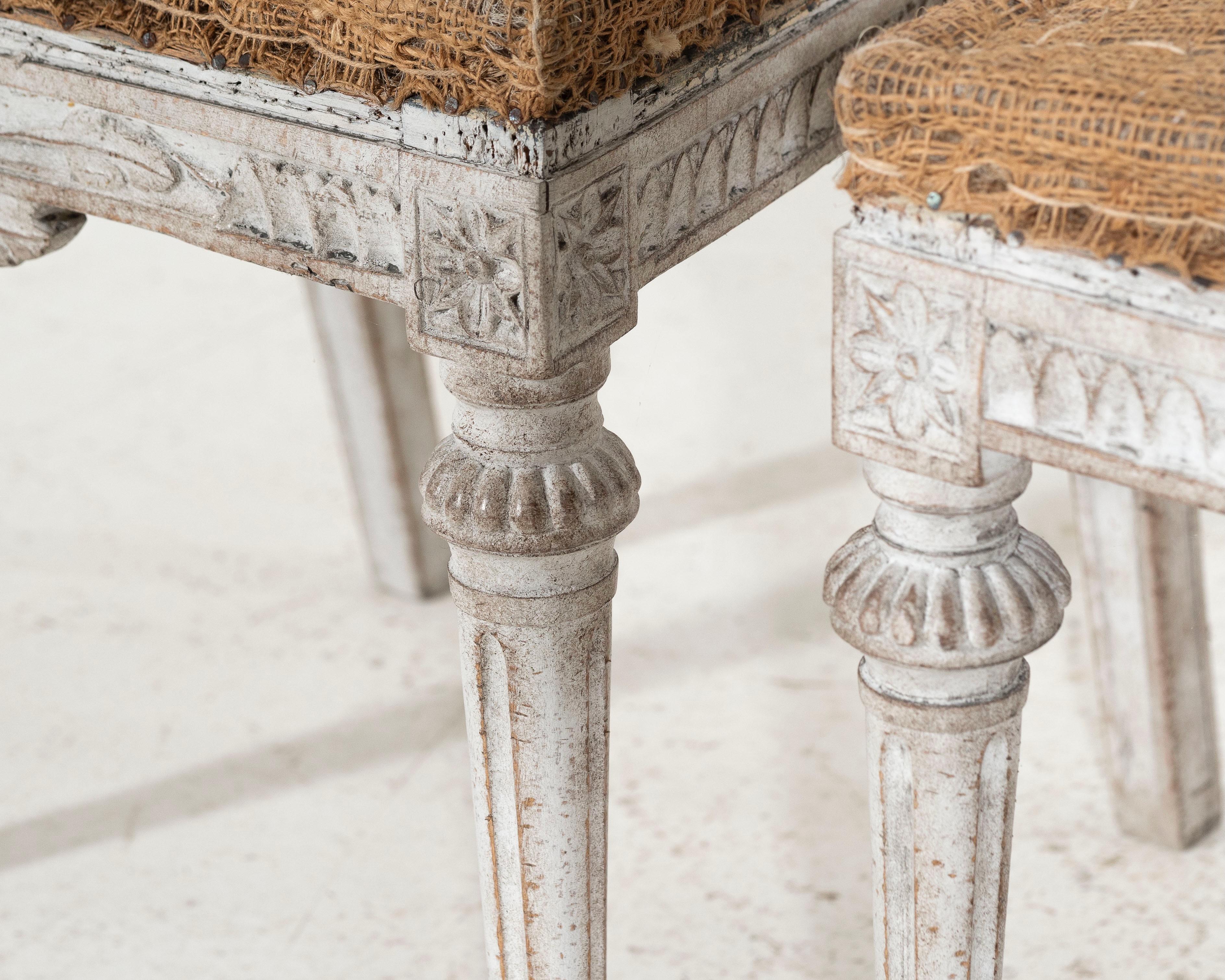 Wood Three richly carved Gustavian side chairs, 18th C. For Sale