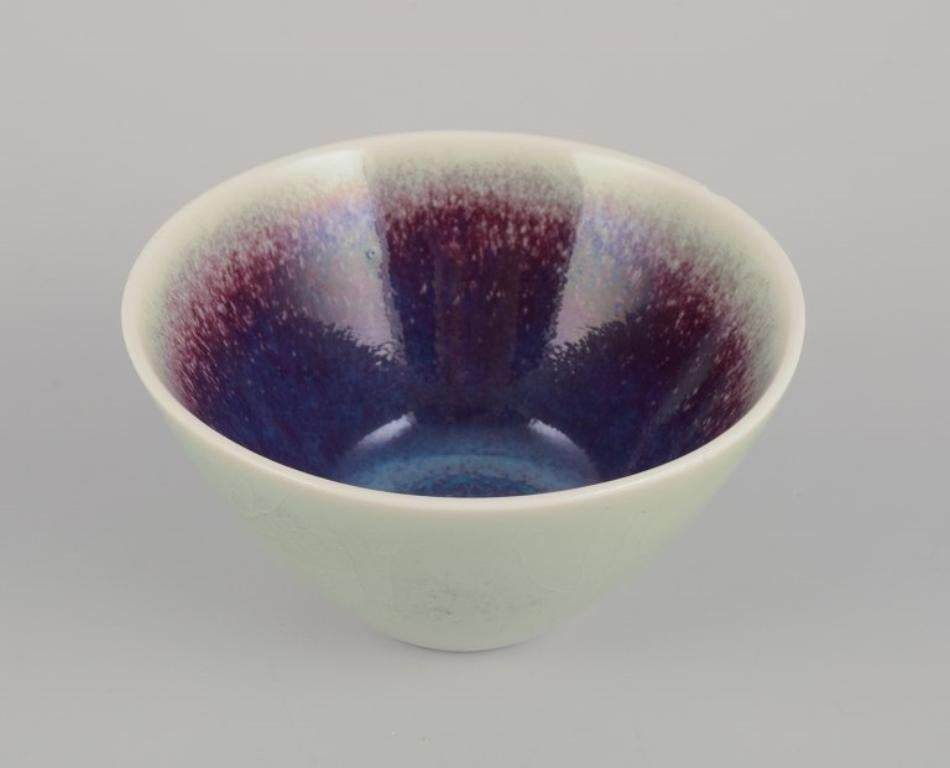 Scandinavian Modern Three Rörstrand ceramic bowls with glaze in violet and green shades. For Sale