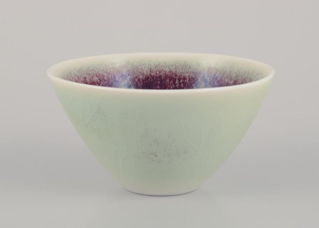 Swedish Three Rörstrand ceramic bowls with glaze in violet and green shades. For Sale
