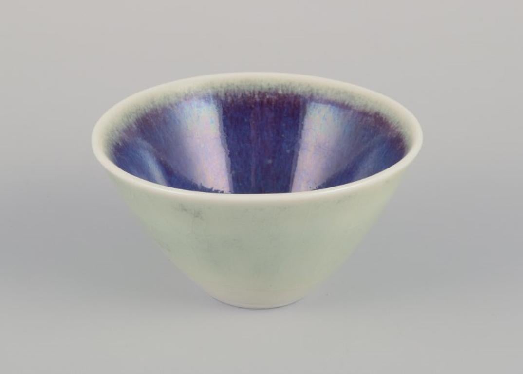 20th Century Three Rörstrand ceramic bowls with glaze in violet and green shades. For Sale