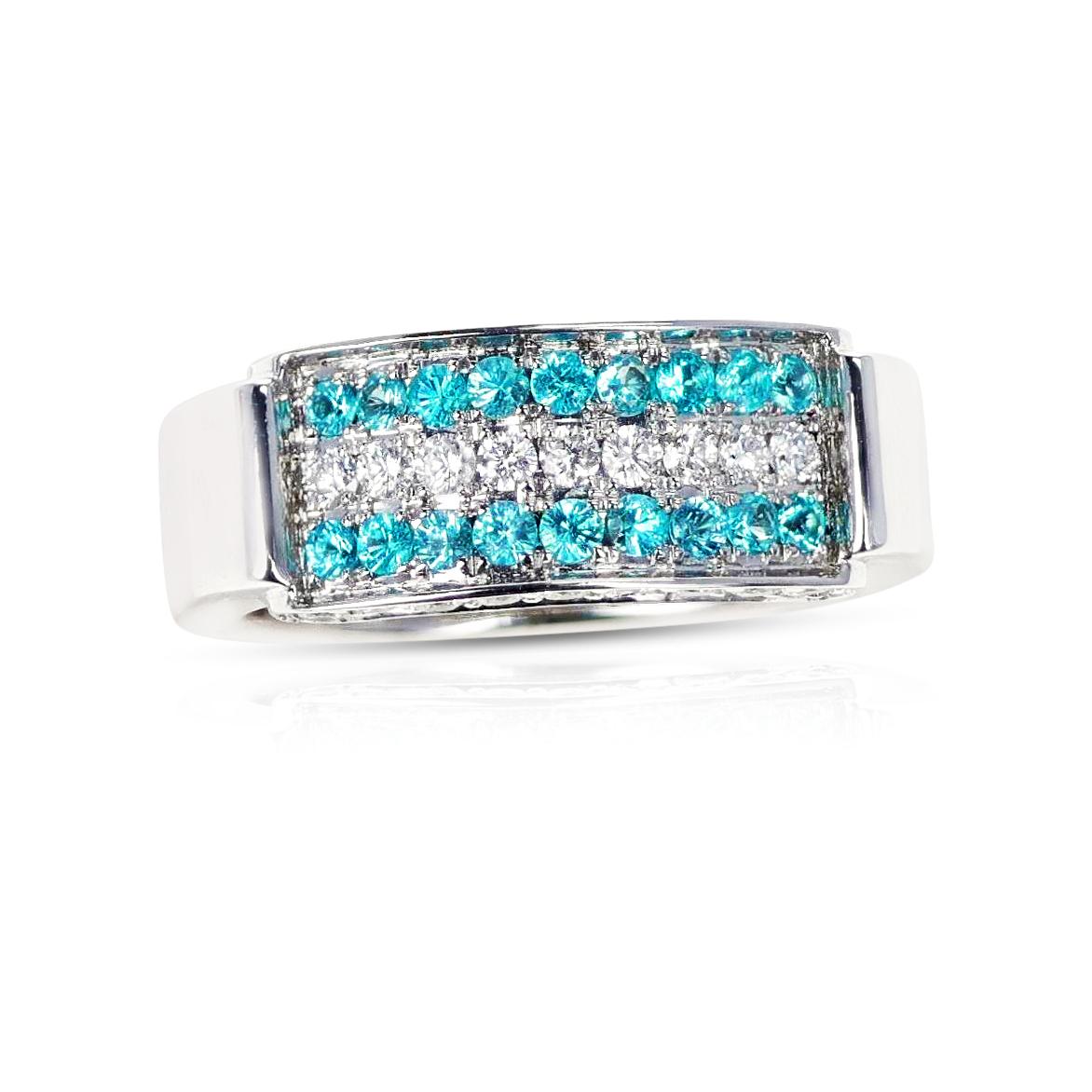A Three Row Brazilian Paraiba and Diamond Wedding Band made in 18 karat Yellow Gold. The Paraiba weighs 0.36 carats and the diamonds weigh 0.60 carats. The total weight of the 9.31 grams. The ring size is US 6.75. 
