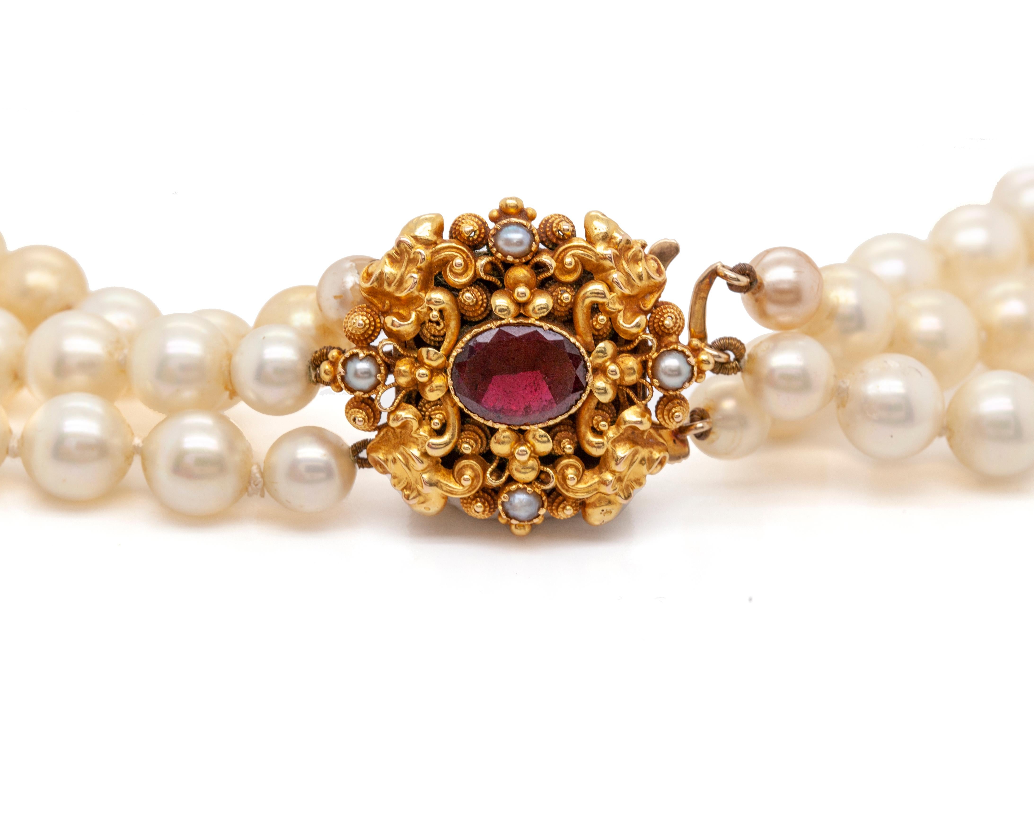Oval Cut Three-Row Cultured Pearl Necklace with Garnet and Seed Pearl Yellow Gold Clasp For Sale