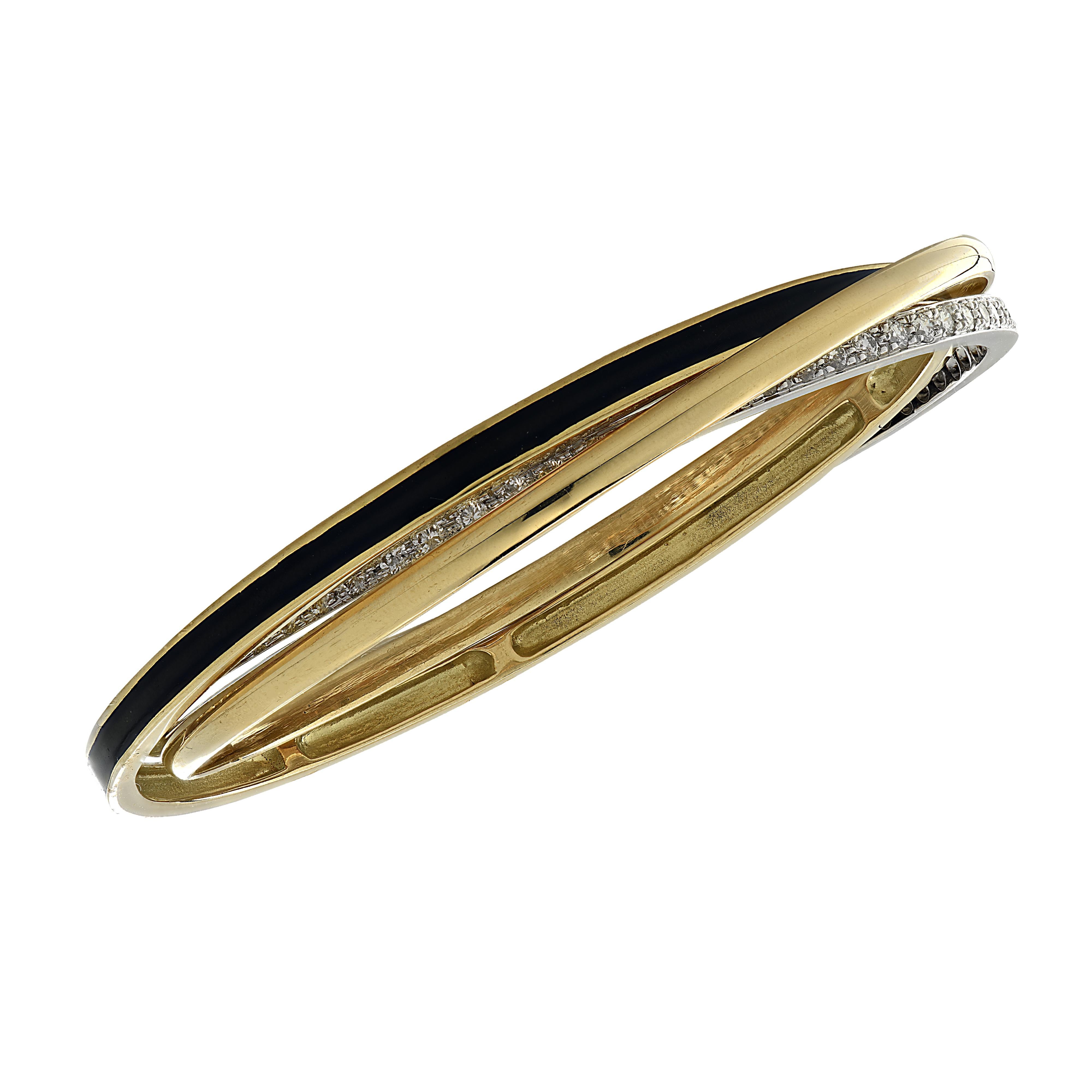 Stunning 3 row bangle crafted in 18 karat yellow and white gold and black enamel, featuring 68 round brilliant cut diamonds weighing approximately 3 carats total, G color, VS clarity. Three bangles, one yellow gold, one yellow gold embellished with