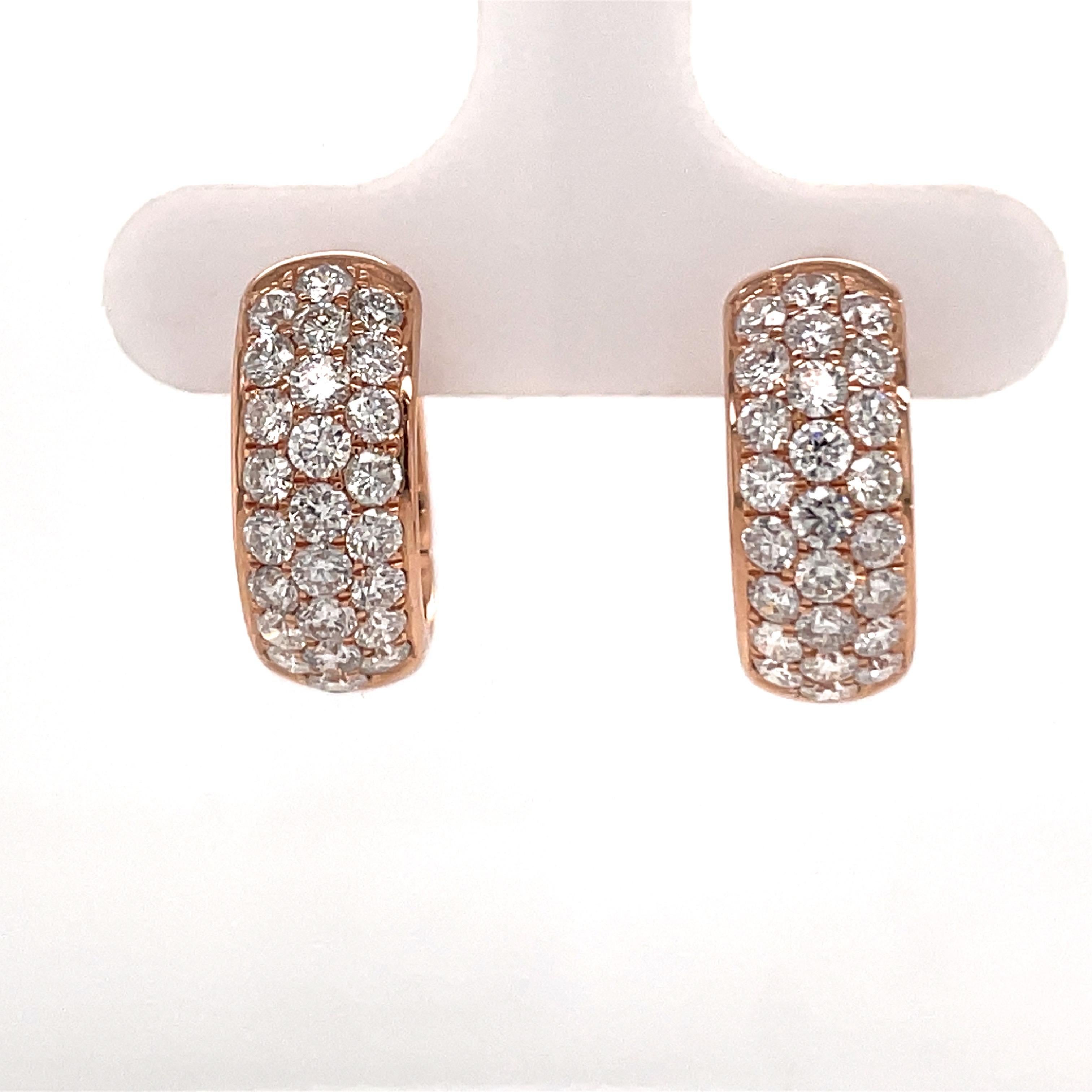 14 Karat Rose gold hoop earrings featuring three rows of round brilliants weighing 1.50 carats.
50 Diamonds
Color G-H
Clarity SI