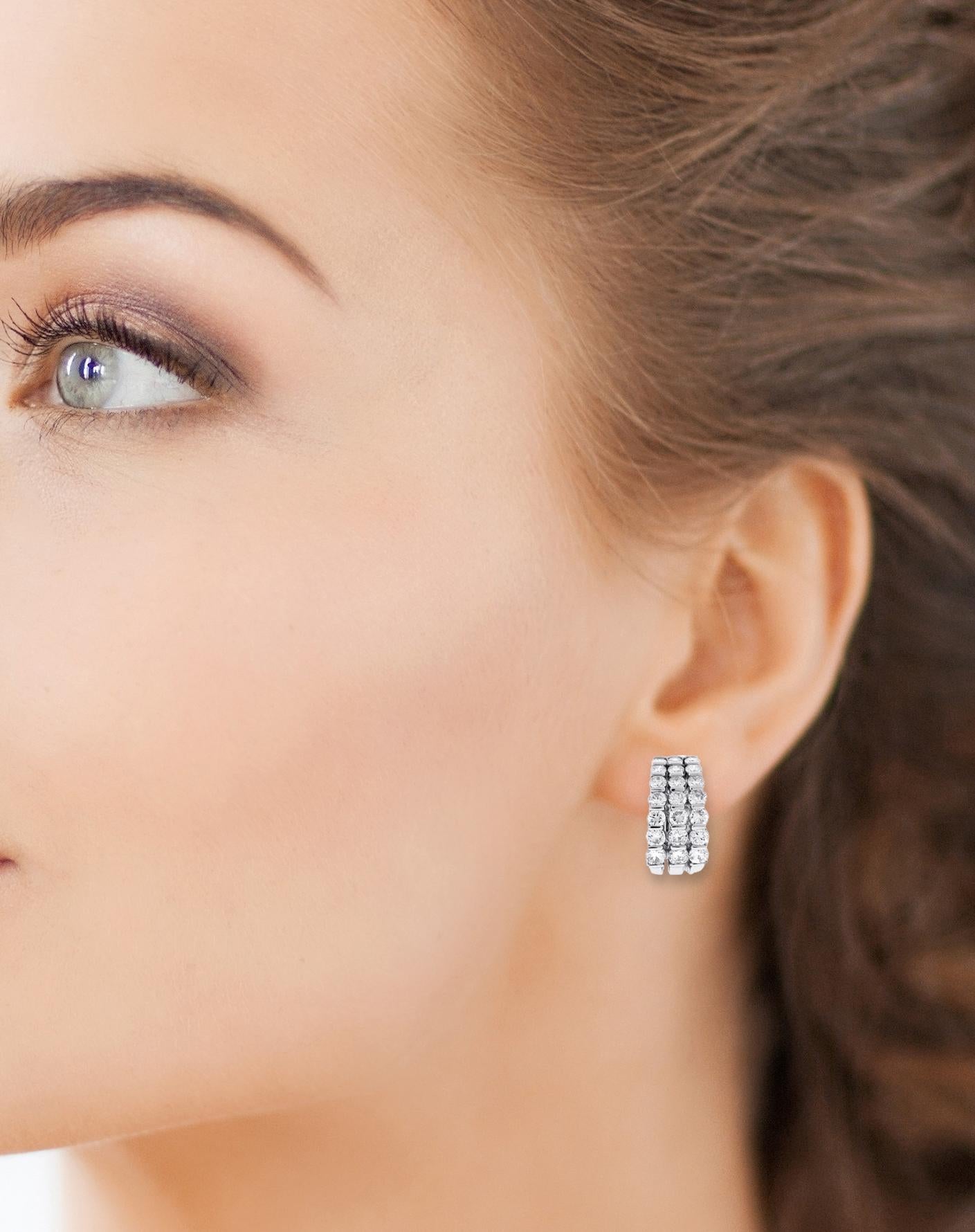 Introducing our exquisite platinum three-row diamond hoop earrings, adorned with 42 round brilliant cut diamonds totaling 3.75 carats.  F-G Color VVS These stunning earrings feature a luxurious design with three rows of meticulously set diamonds,