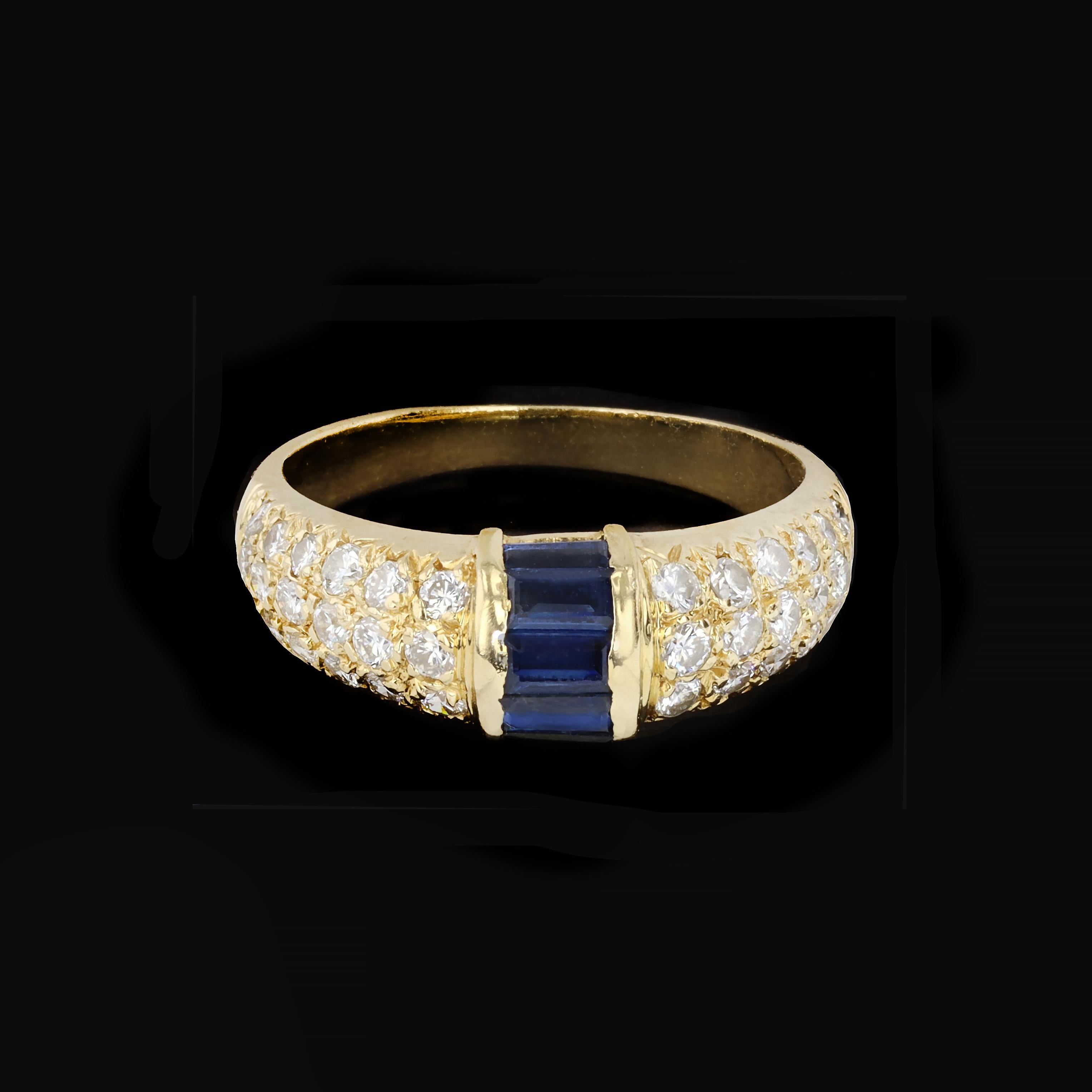 Sophisticated with standout style, this can be your go-to ring that will coordinate with everything. Three shimmering rows of round cut diamonds, weighing approximately 0.80ct,. are accented by a band of five baguette cut sapphires. Set in 14K