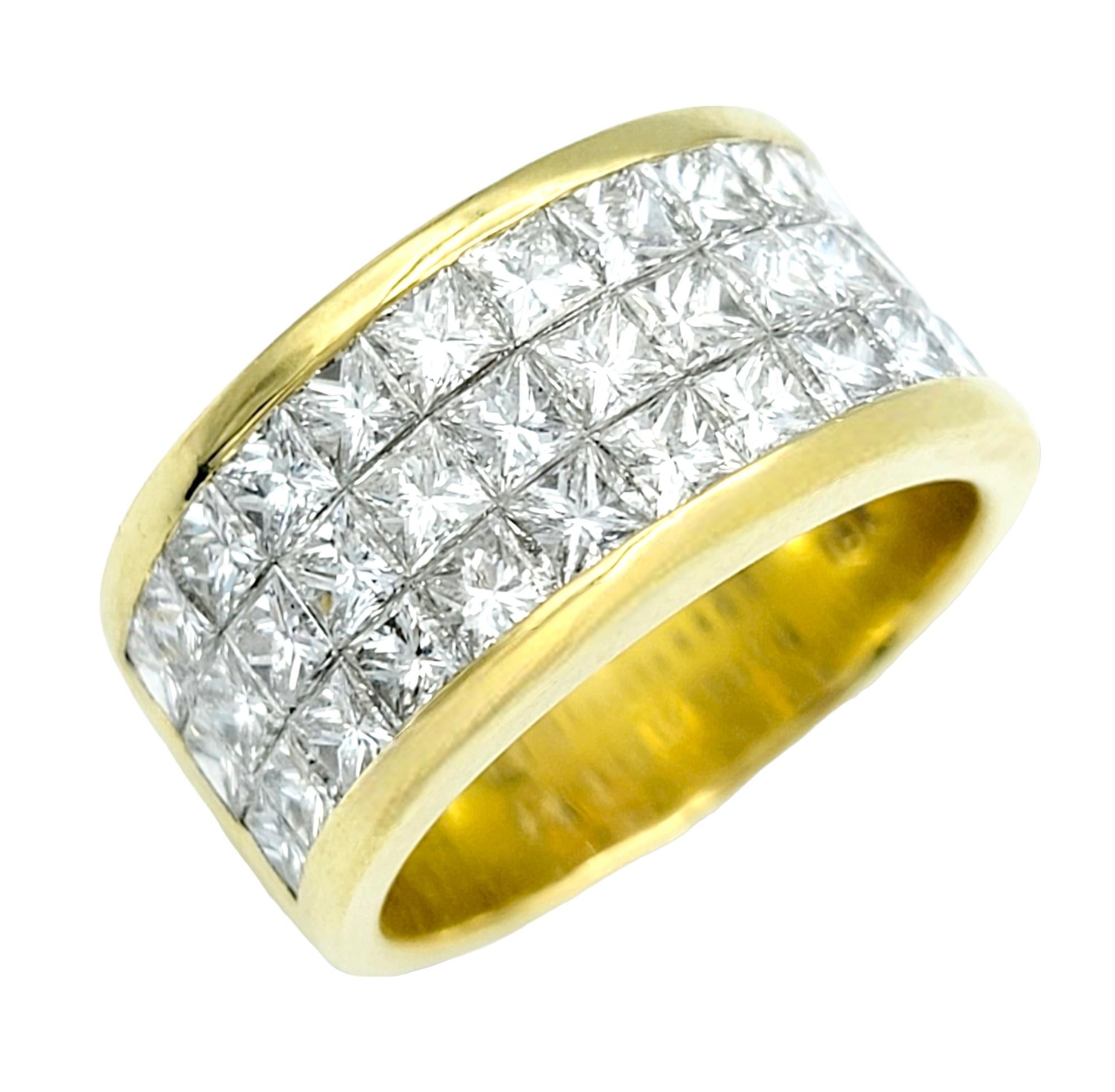 Ring size: 7.25

This stunningly sparkly 18 karat gold band ring is a dazzling testament to timeless elegance and contemporary sophistication. The focal point of this stunning ring are the three rows of shimmering princess-cut diamonds that are