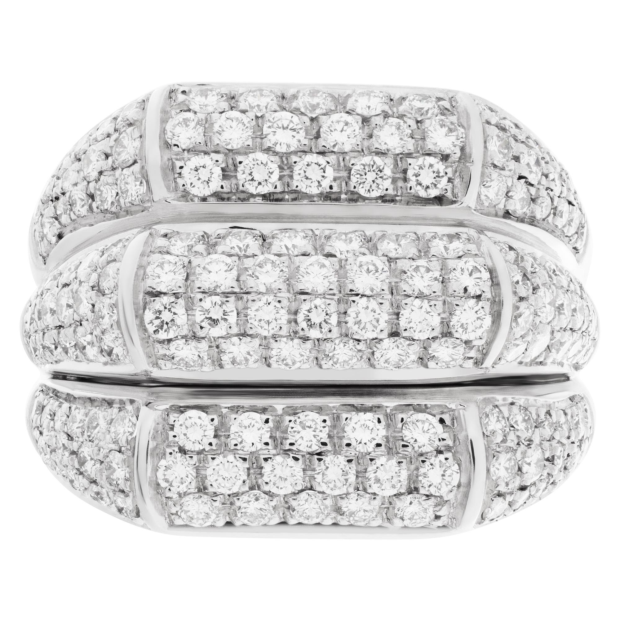 Elegant three-row pave diamond ring in 18k white gold with approximately 2.5 carats in round cut G-H color, VS clarity diamonds. Head measures 23mm x 17mm, shank 5mm thick. Size 7.

This Diamond ring is currently size 7 and some items can be sized