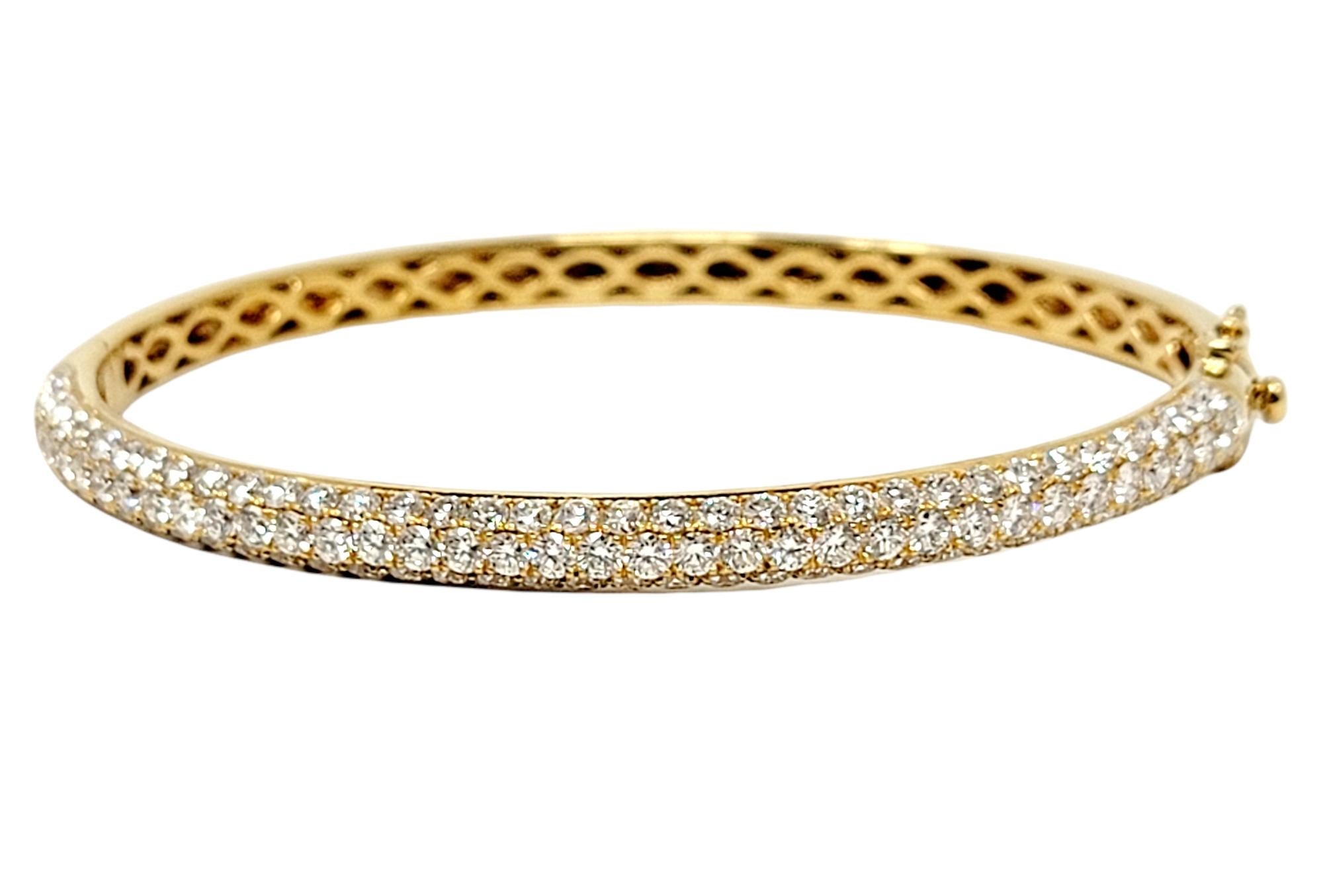 Absolutely beautiful pave diamond bangle bracelet by Oliver Smith Jeweler. The sleek, modern design bursts with sparkle from all angles from the stunning natural icy white diamonds. This incredible piece can be stacked with other bracelets or worn