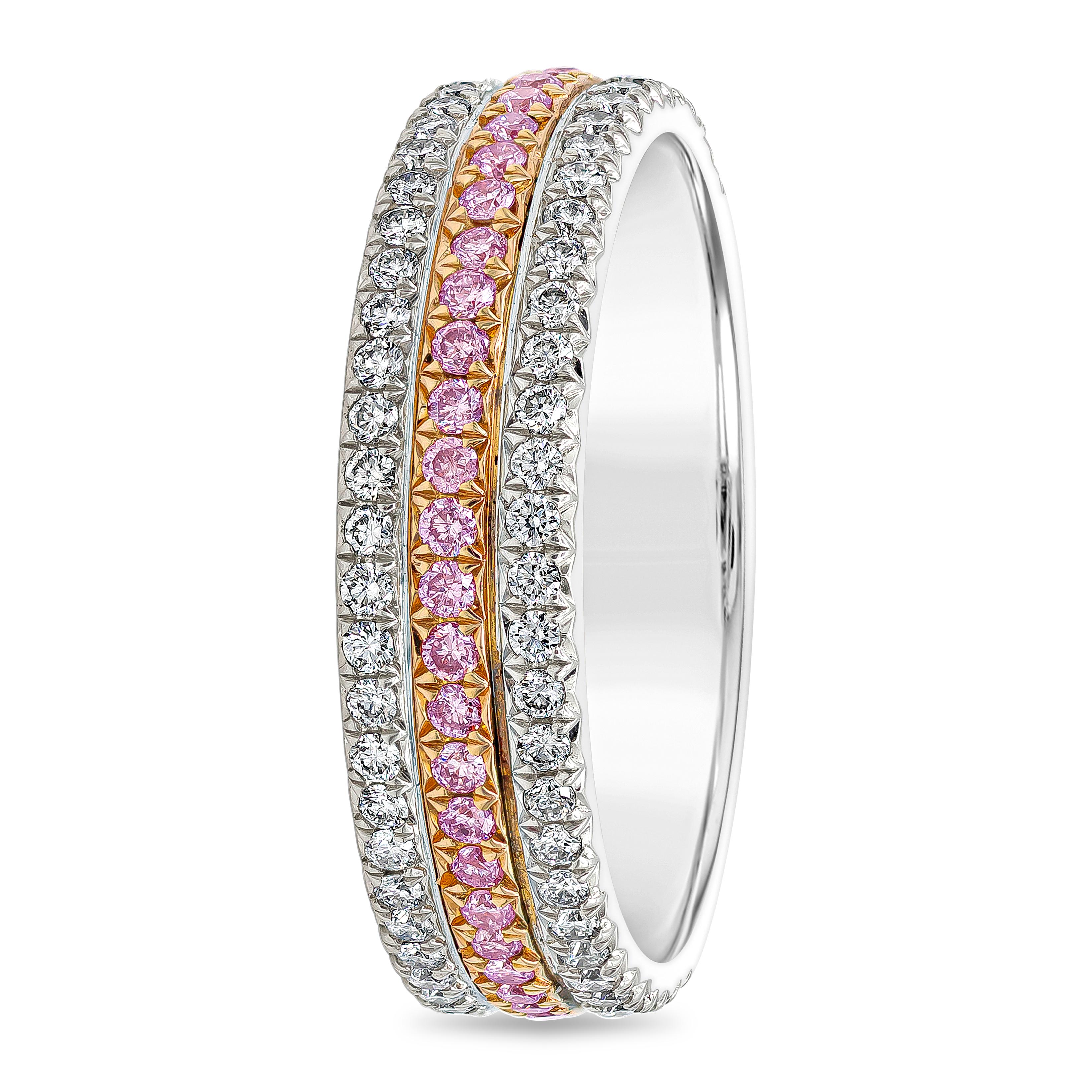 Elevate glamour and style with this three row diamond wedding band. Sandwiched in-between 2 rows of sparkling round diamonds is a line of color-rich pink diamonds set in 18k rose gold. Pink diamonds weigh 0.25 carats total while white diamonds weigh