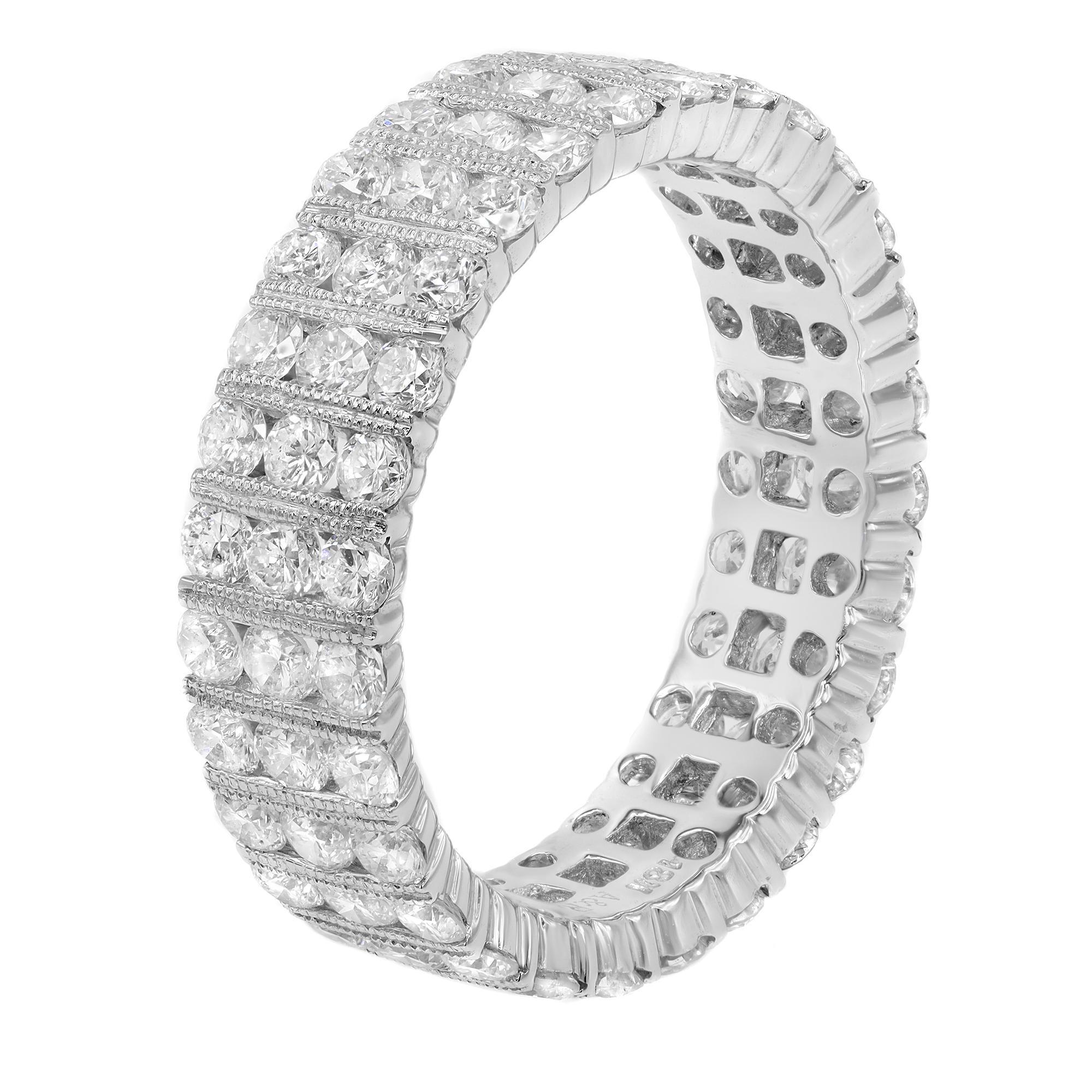Three rows of sparkling white round cut diamonds are showcased on this triple row band. Wear as a wedding or anniversary band. Total carat weight: 2.57. Diamond color G and VS clarity. Ring size 7. Width of the band: 6.00mm. Comes with a presentable