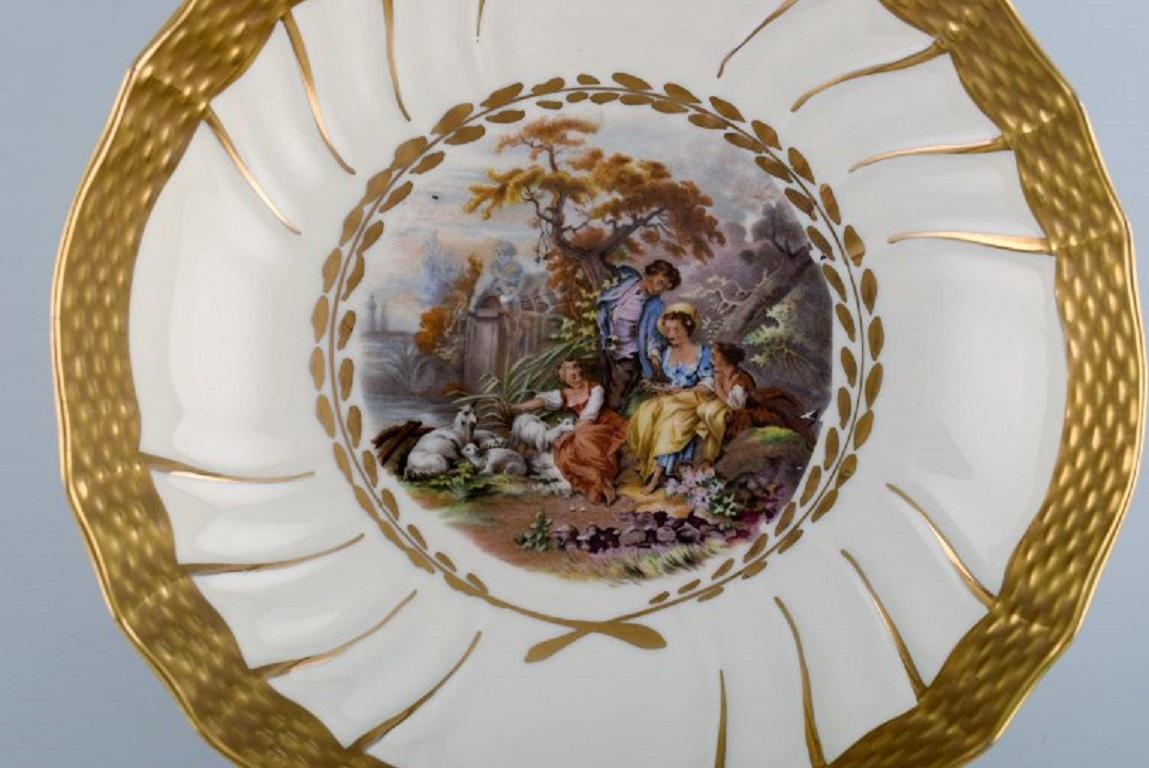 20th Century Three Royal Copenhagen bowls decorated with flowers and romantic scenery.  For Sale