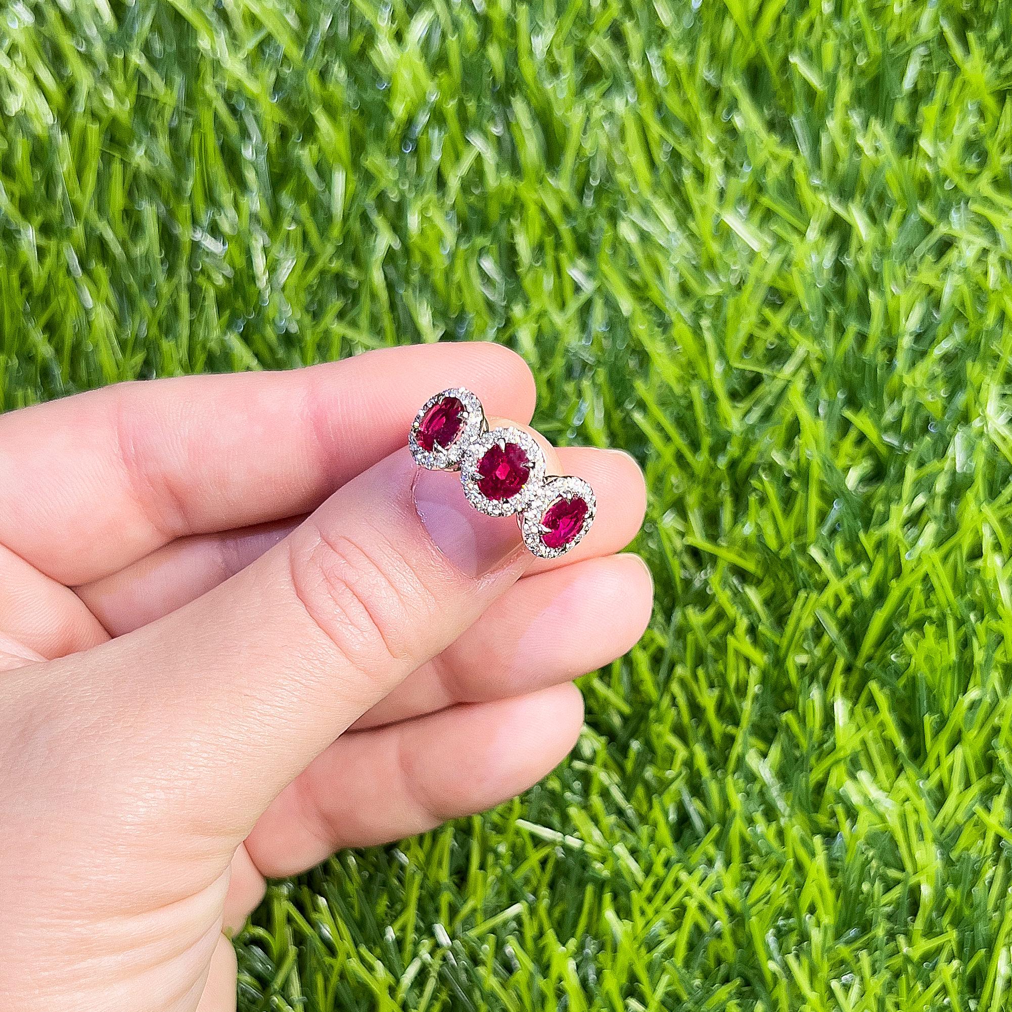 Oval Cut Three Rubies Ring Diamond Setting 3.21 Carats 18K White Gold For Sale