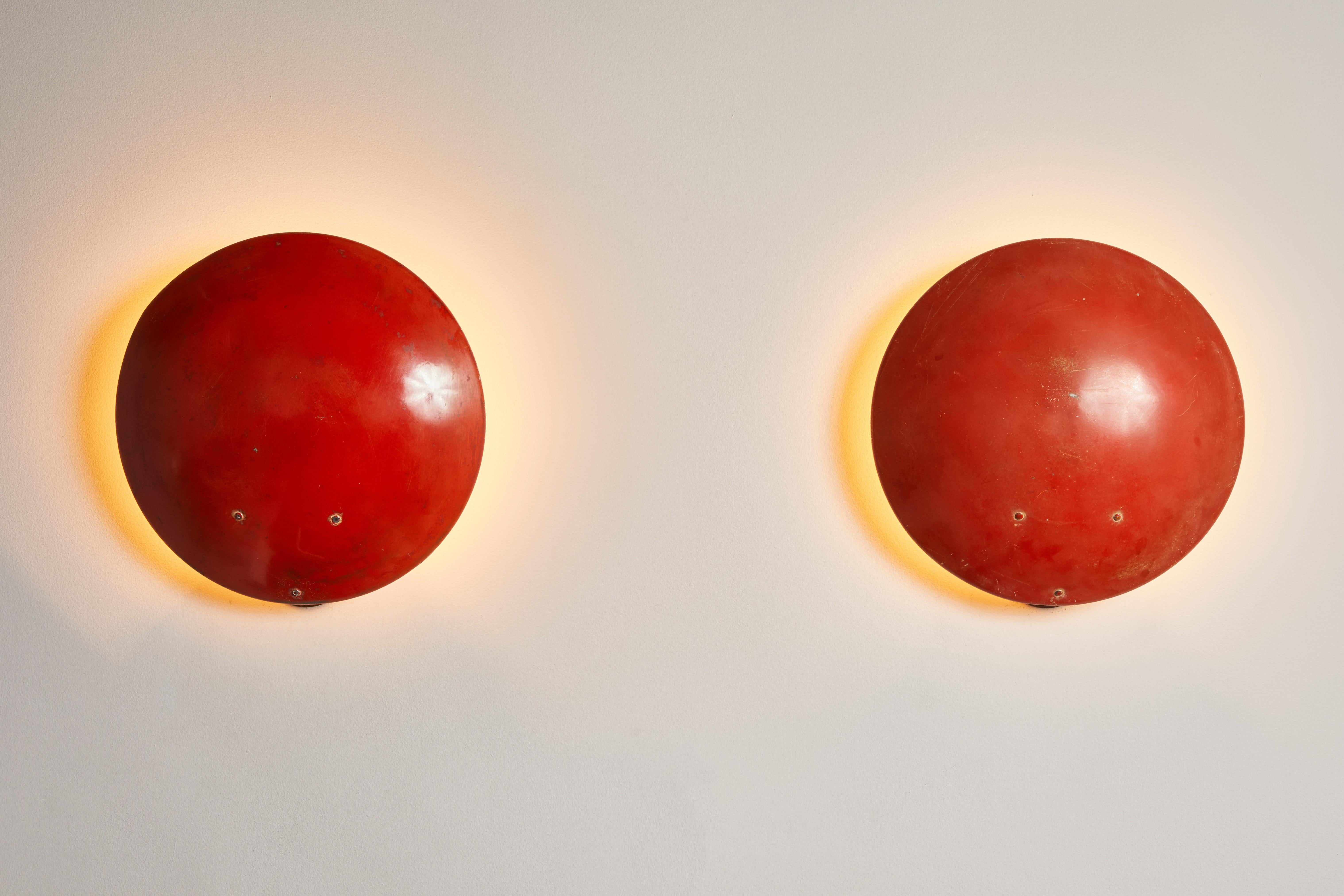 Single Sconce by Bruno Gatta for Stilnovo. Designed and manufactured in Italy, 1955. Original enameled aluminum, brass. Rewired for U.S. junction boxes. Custom brass backplates. Each light takes one E27 100w maximum bulb. Bulbs provided as a onetime