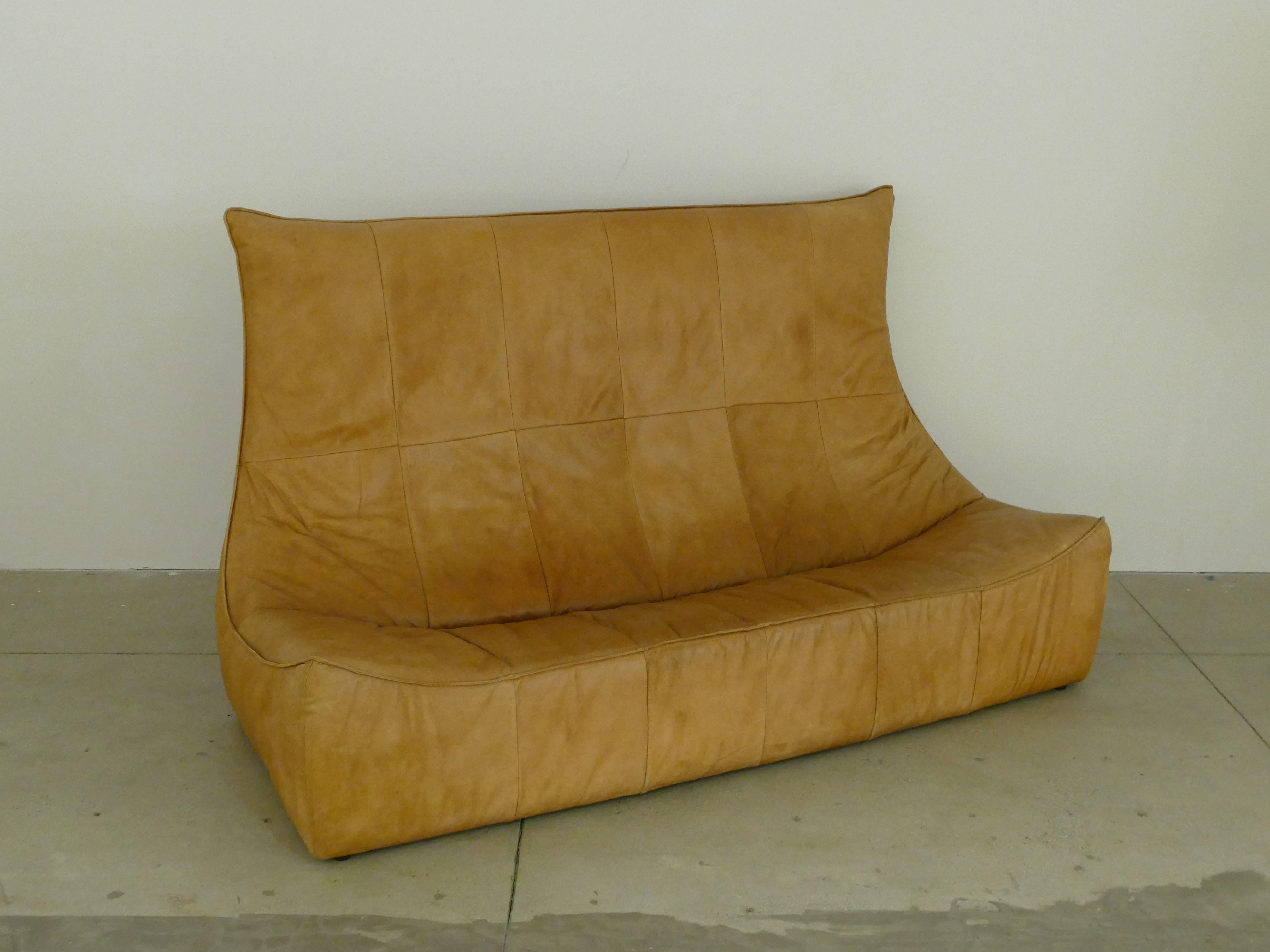 Original and authentic leather sofa by the Dutch designer Gerard van den Berg. Beautiful patina with no stains or marks on the leather. Stylish, comfortable and highly sought out piece of art or furniture. Sofa is in our showroom in the NY Design