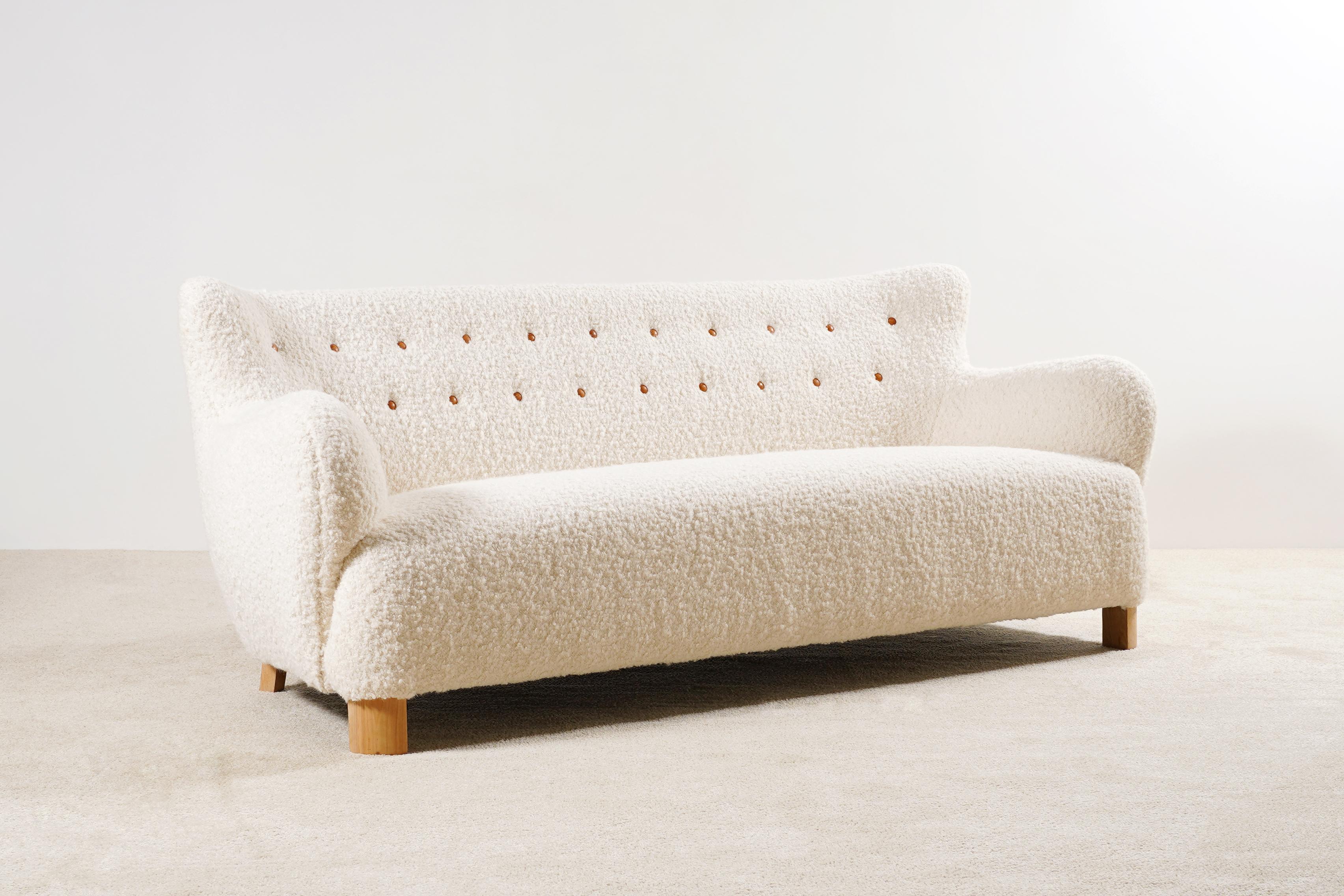 This Three-seat curved sofa is an original piece from the 1940s, manufactured in Denmark.
Unknown designer but the style is similar of Flemming Lassen's sofa designs made by AJ Iversen, and Fritz Hansen productions from The 40's.
Lovely shape and