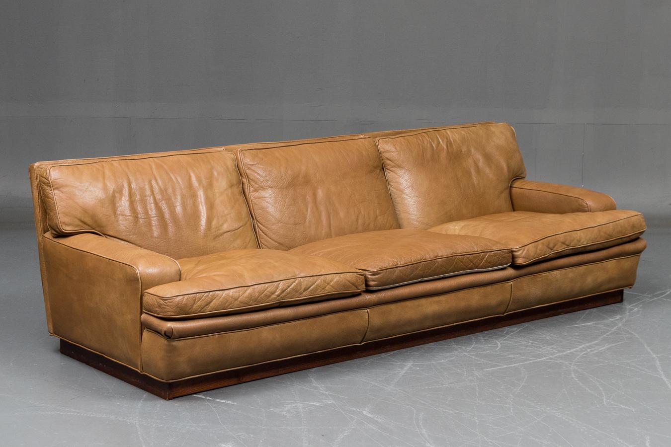 Fantastic 3-seat sofa designed by Arne Norell in the late 1960's as Model Mexico. The model was produced trough the 1970's and 80's. Made from Buffalo hide that remains very supple and with nice patina and only minimal wear. The padding remains soft