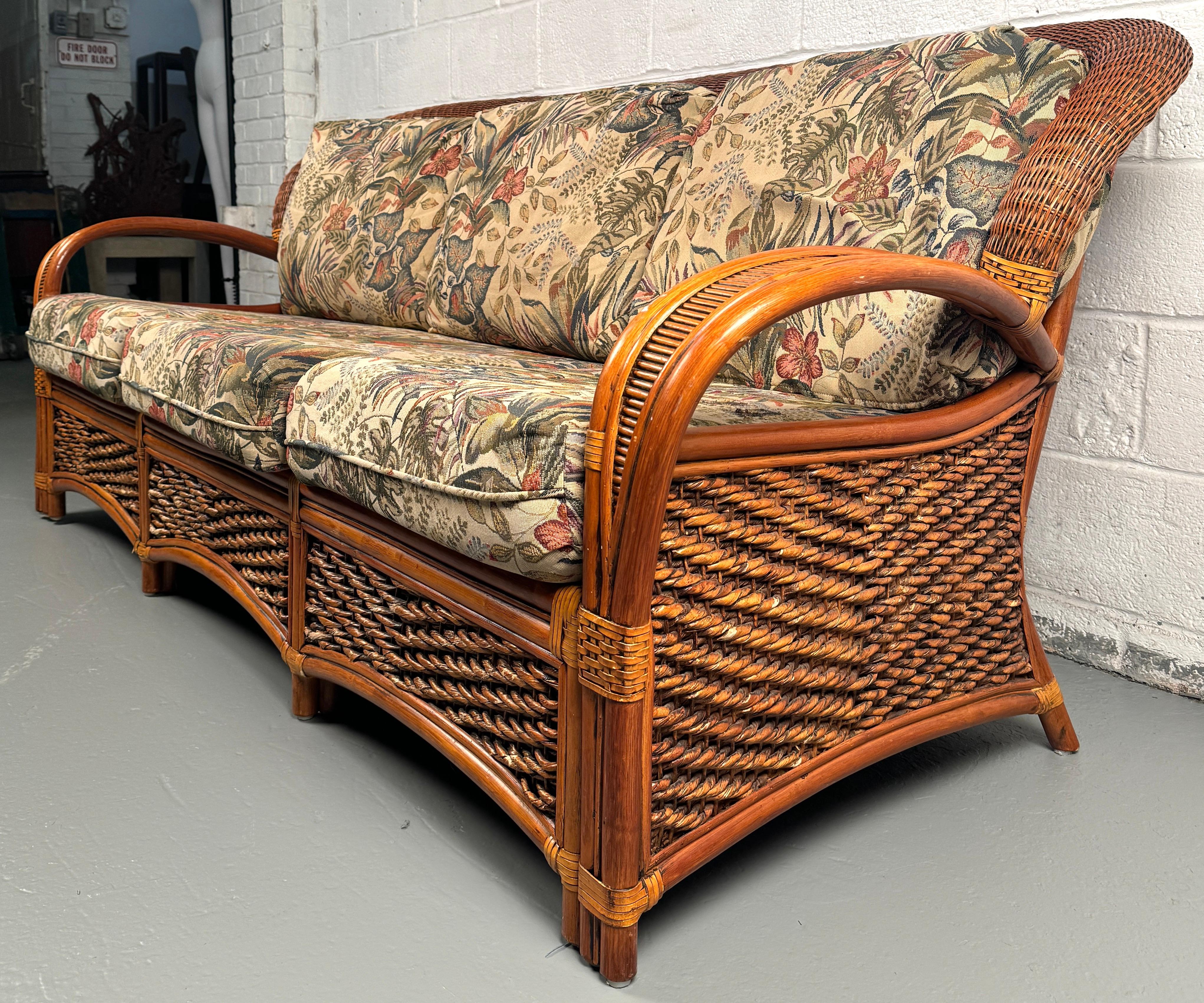 Transform your living or lounge space into a sun-drenched retreat with this vintage Palm Springs rattan sofa—a statement piece that effortlessly blends breezy, resort-inspired design with mid-century craftsmanship.

Please confirm location with