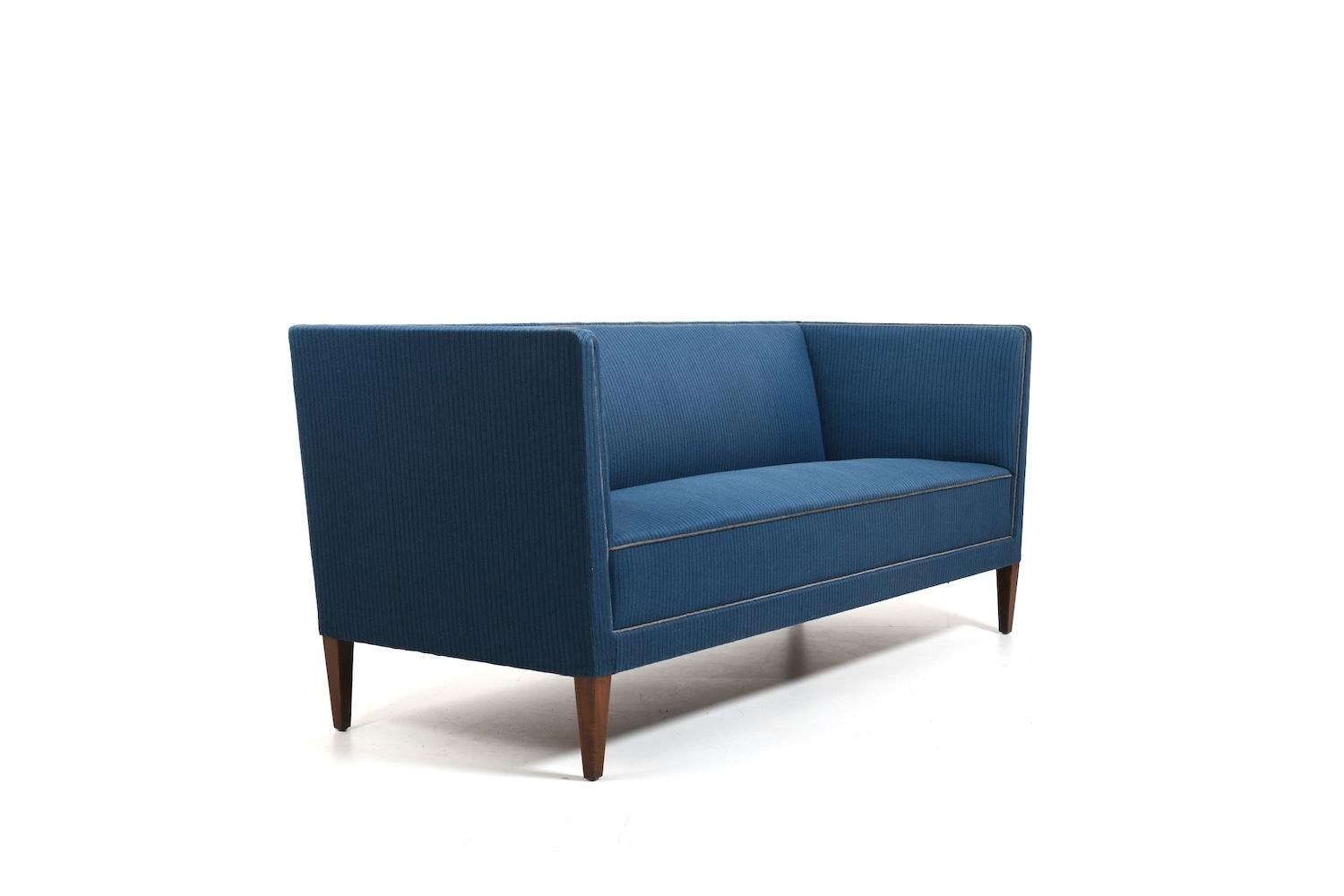 Three seat sofa by the famous danish cabinetmaker and designer Frits Henningsen 1930s. In original untouched condition, with blue fabric. This is upholstered by Frits henningsen's favorite upholsterer Holger Post. Very fine quality.

Provenance