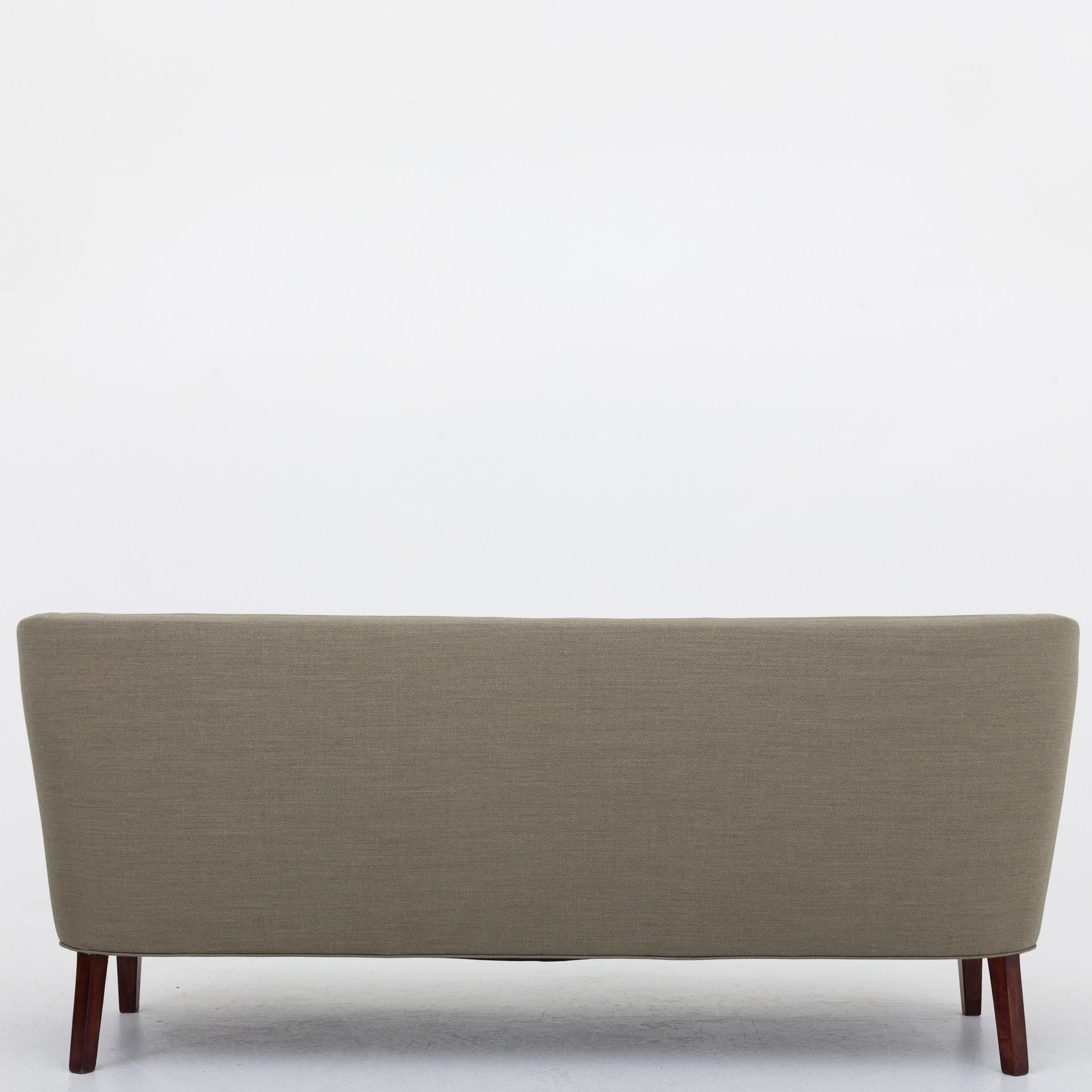 Three-seat sofa, reupholstered with Fiord 951 (wool). Seat in Fiord 961. Legs in stained beech.