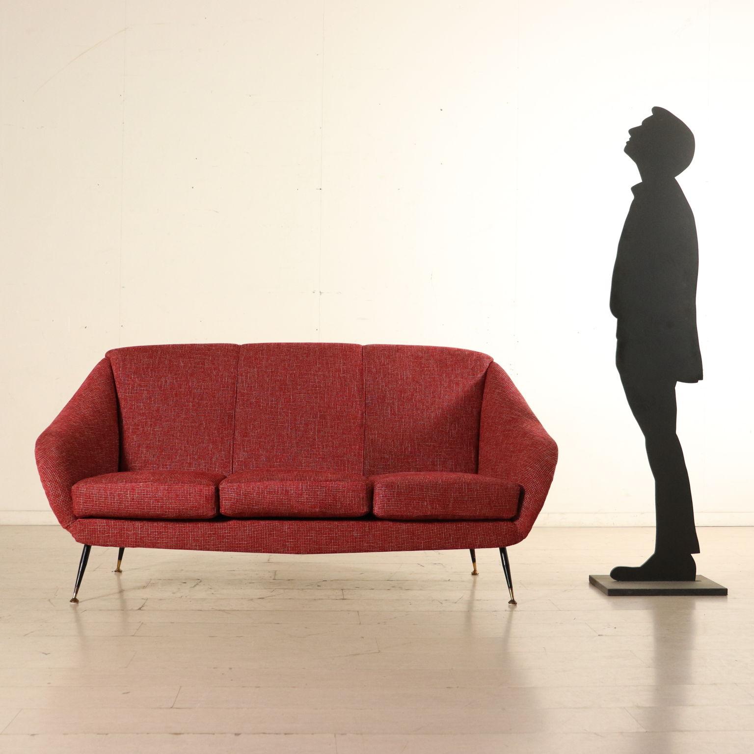 A three-seat sofa. Foam padding, fabric upholstery, metal and brass legs. Manufactured in Italy, 1960s.