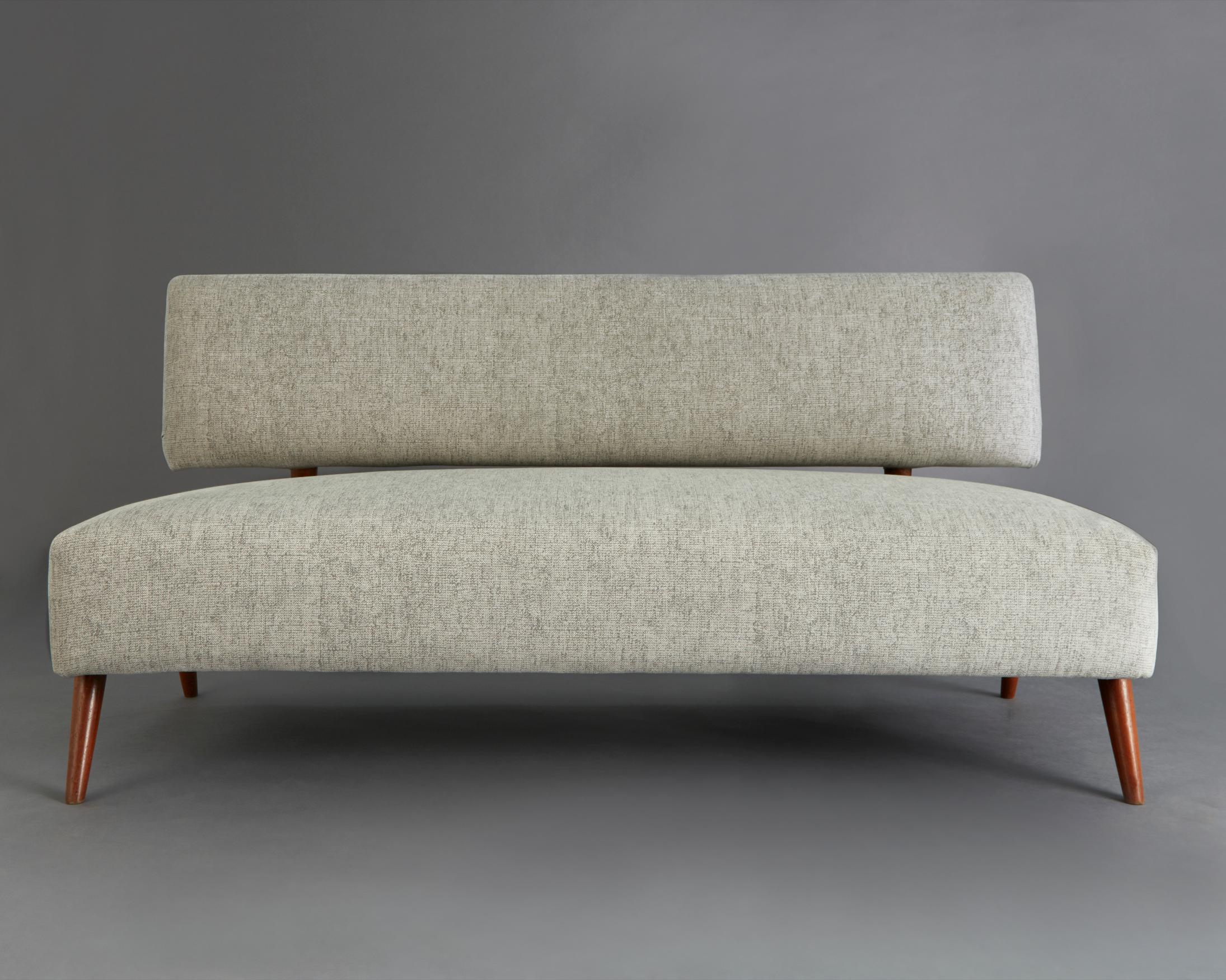 Three-seat sofa in pau marfim and upholstery. Designed and made by Joaquim Tenreiro, Brazil, circa 1960s.
  