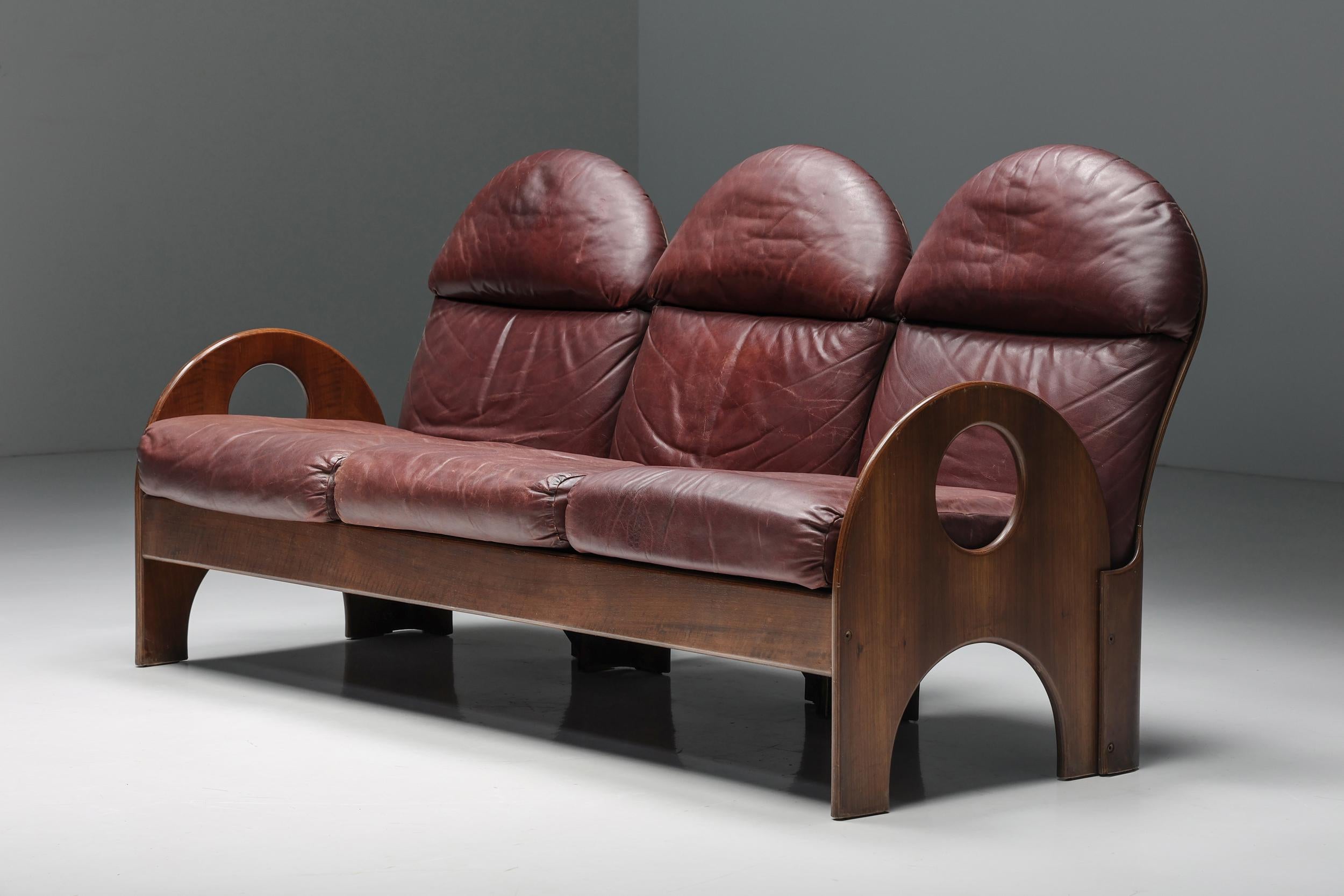 Gae Aulenti; three-seater; Arcata; Poltronova; Italian Design; Italy; 1968; walnut; burgundy leather; Mid-Century Modern;

Three-Seater 'Arcata' by Gae Aulenti, walnut and burgundy leather, 1968
 
This three-seater 'Arcata' sofa is designed by