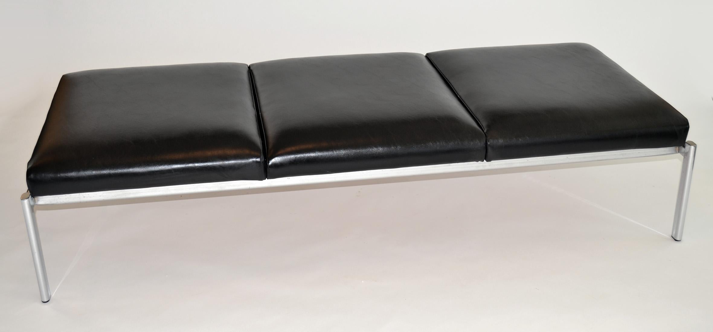 Three-seat bench in leather and chrome by Stendig designed by Ilmari Tapiovaara. A bench or daybed in black leather with three attached cushions on a chromed steel base. Bank asset tag remains.
  