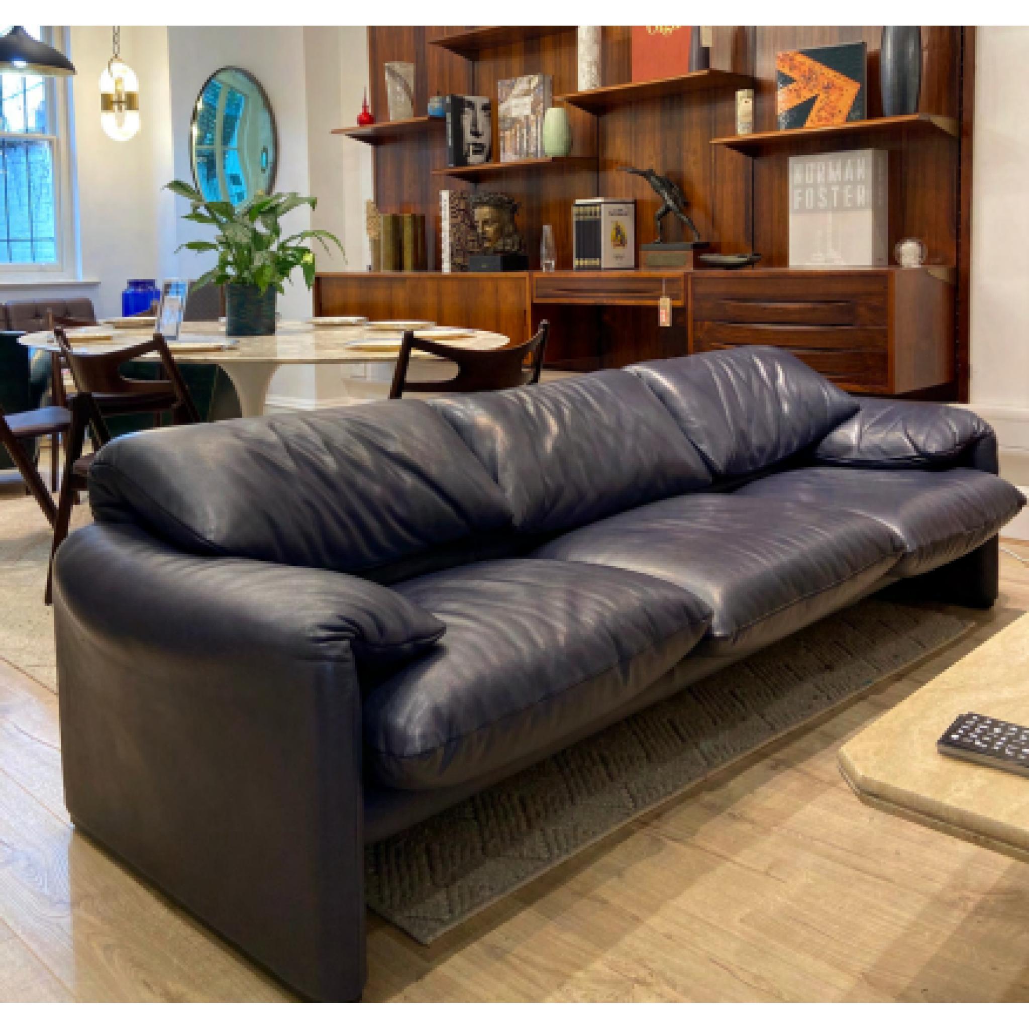 Three seater 'Maralunga Sofa By Vico Magistretti For Cassina in Navy Leather 

The Maralunga sofa was created in 1973 by Vico Magistretti for the Italian firm Cassina.

Known for his creations using simple, essential forms and the use of innovative