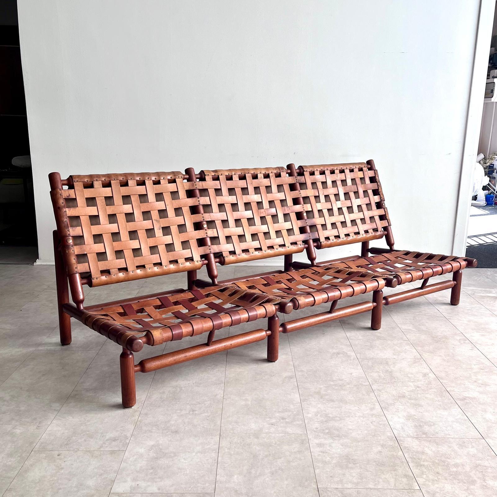 A rare collaboration between Finnish designer Ilmari Tapiovaara and Italian manufacturer Paolo Arnaboldi, this 1970s three-seater sofa exemplifies the fusion of Nordic clarity with Mediterranean craftsmanship. The piece features a solid wood frame