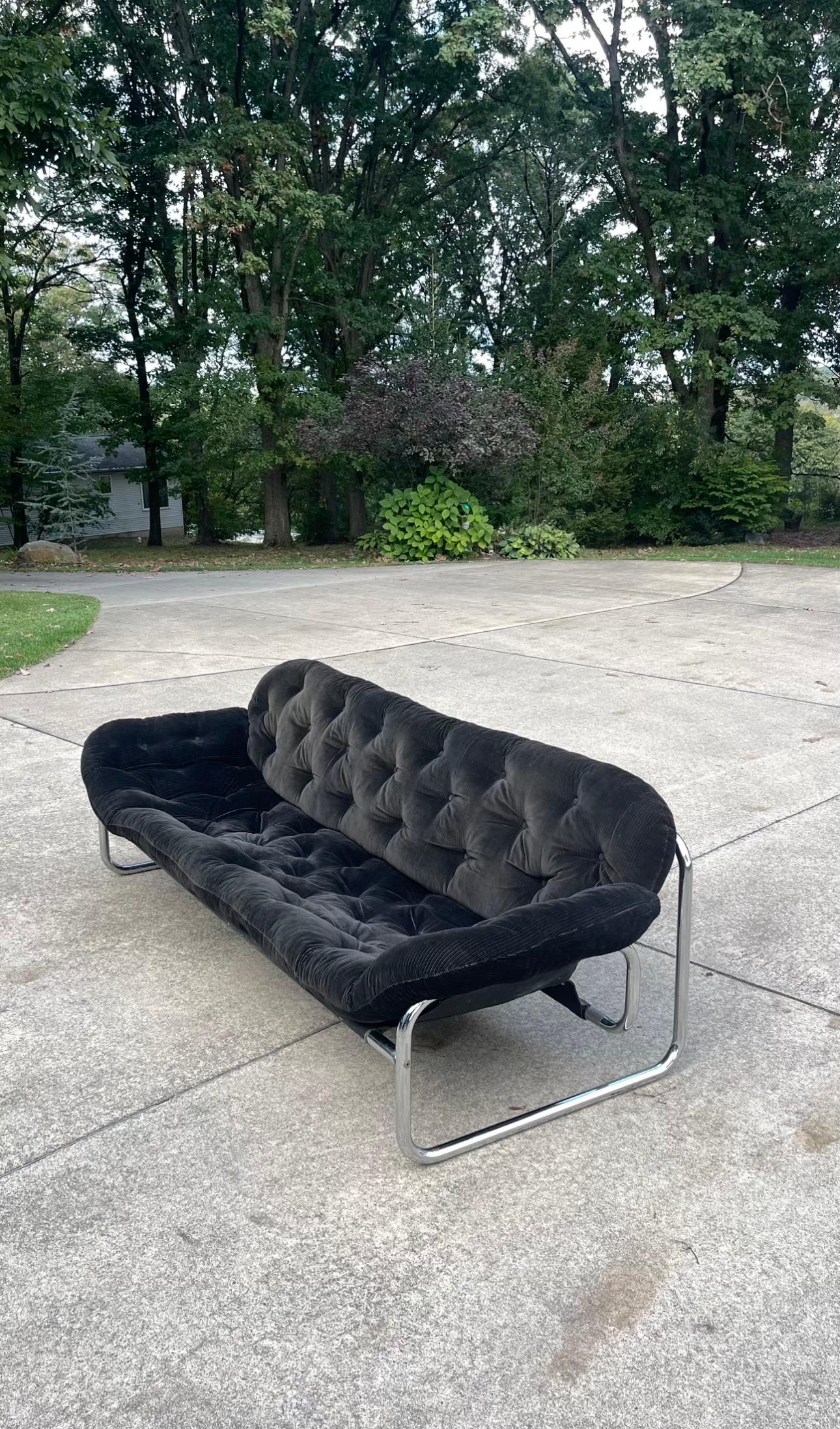 Three-Seater Sofa by John-Bertil Häggström for the Swedish manufacture Swed-Form, Skillingaryd during the 1970s. The sofa is upholstered in black corduroy with even quilting. The seat and backrest are separate elements and large pillows are combined