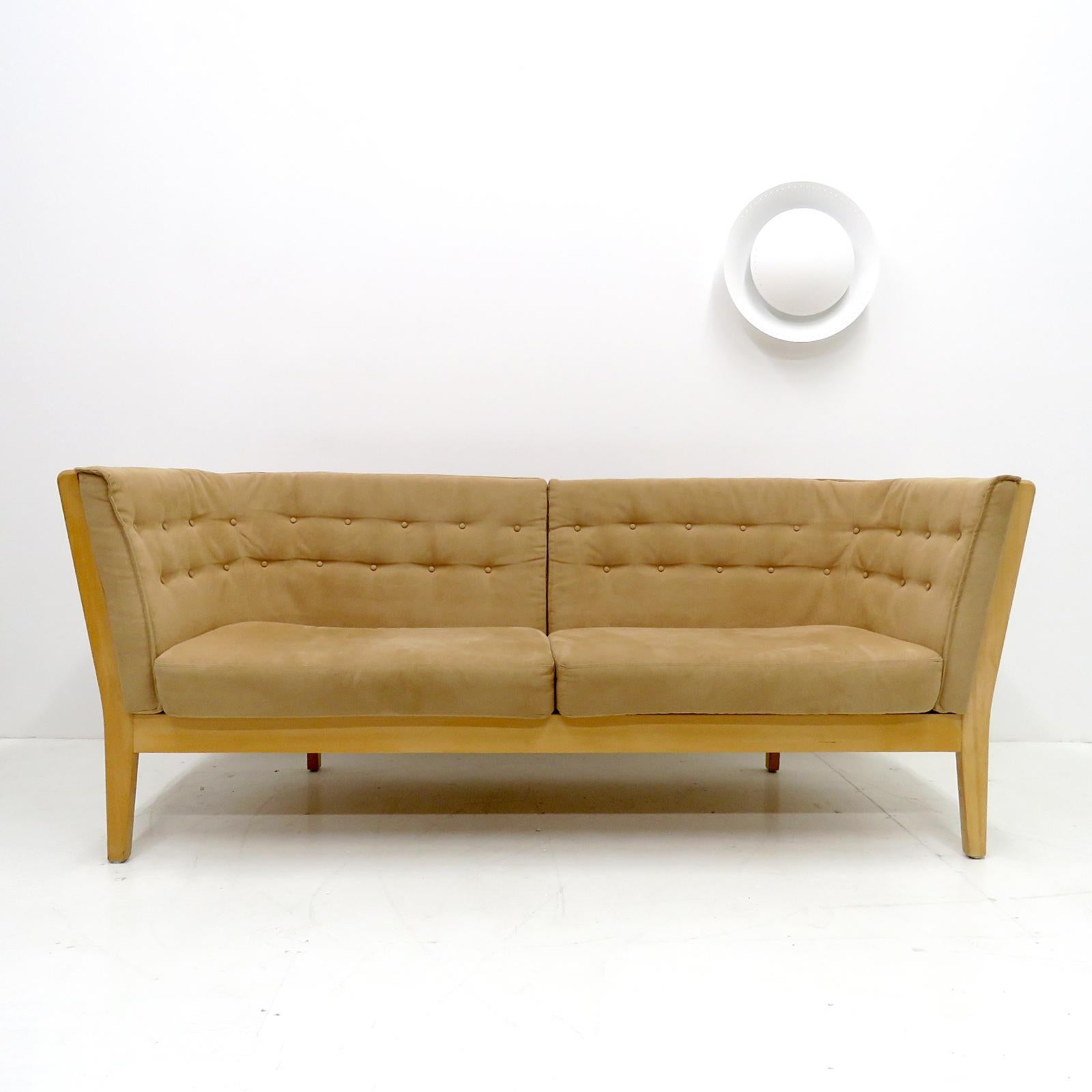 Wonderful Danish modern three seater sofa 'Maria', designed by Wojtek Depka Carstens for Stouby Mobler, with solid soap-treated beech wood frame and upholstered with tufted beige/camel colored alcantara (suede).