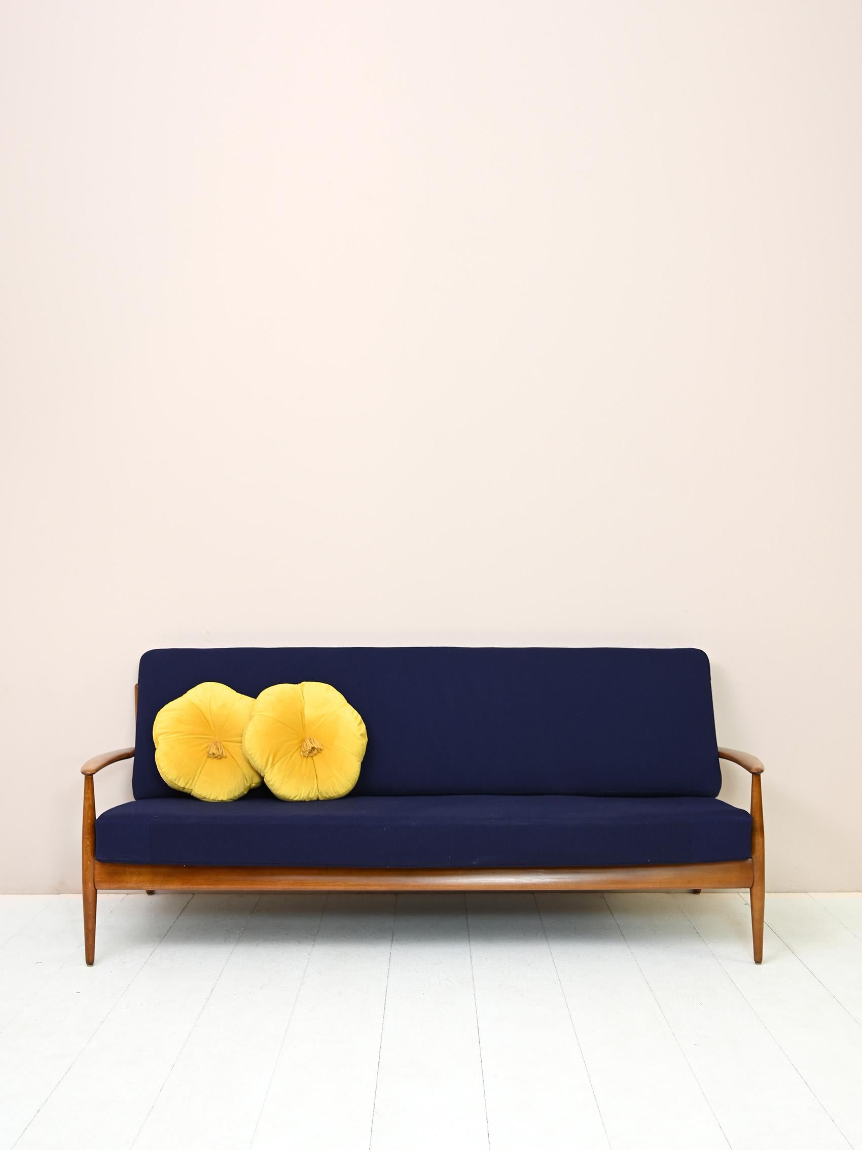 Iconic sofa by Danish designer Grete Jalk, who designed in the 1960s.

The design and material immediately recalls the Danish mid-century modern style.

The sofa is three-seater and features a solid frame.

Good condition. It has been treated with