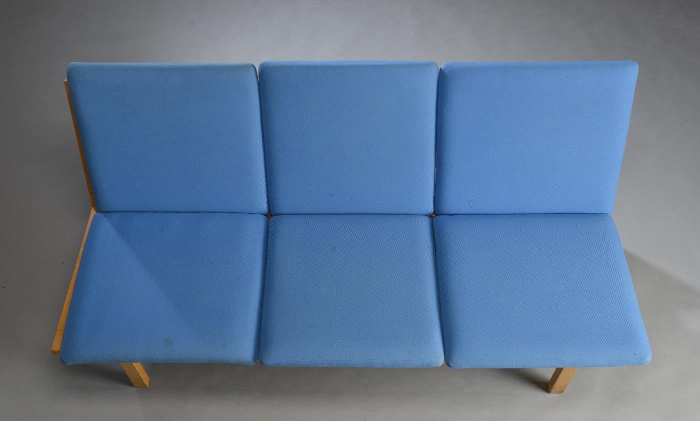 Three-seat sofa, model 2218, by Børge Mogensen. Oak frame with loose cushions upholstered in blue wool. Manufactured at Fredericia Stolefabrik, model 2218.