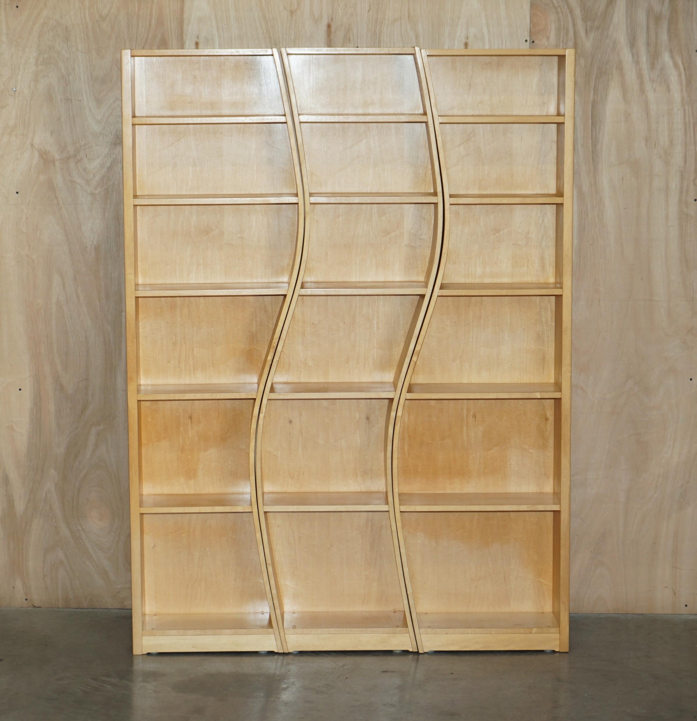 We are delighted to offer for sale this very cool three piece library bookcase with wavey lines

A very good looking and well made suite, they can be used as three separate pieces or as one large bookcase as you can see in the pictures. The timber