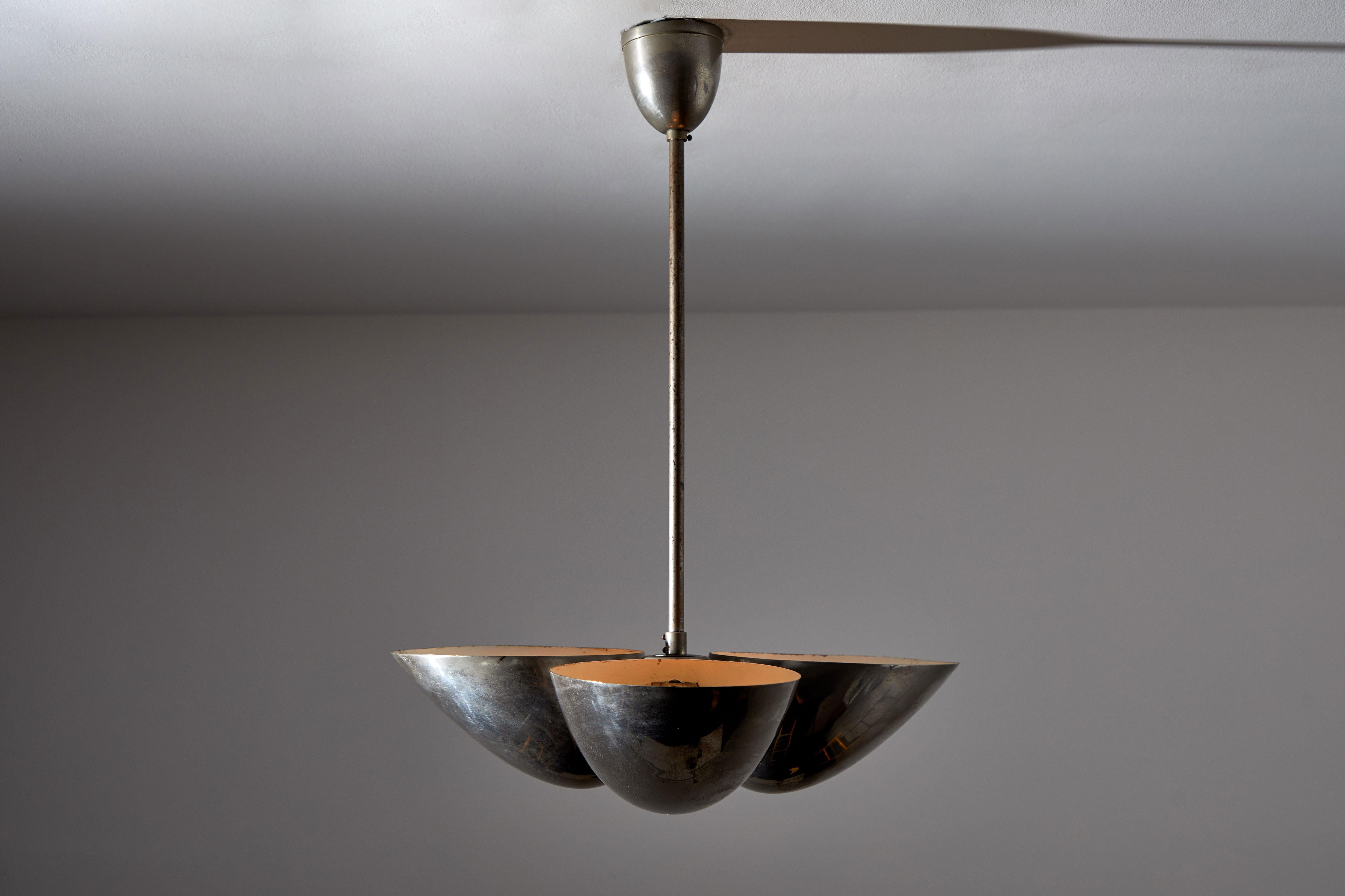 Three-shade Bauhaus chandelier by Zukov. Manufactured in Czech republic circa 1930s. Nickel plated brass. Original canopy. Rewired for US junction boxes. Takes three E27 60w maximum bulbs. Bulbs included as a one time courtesy.