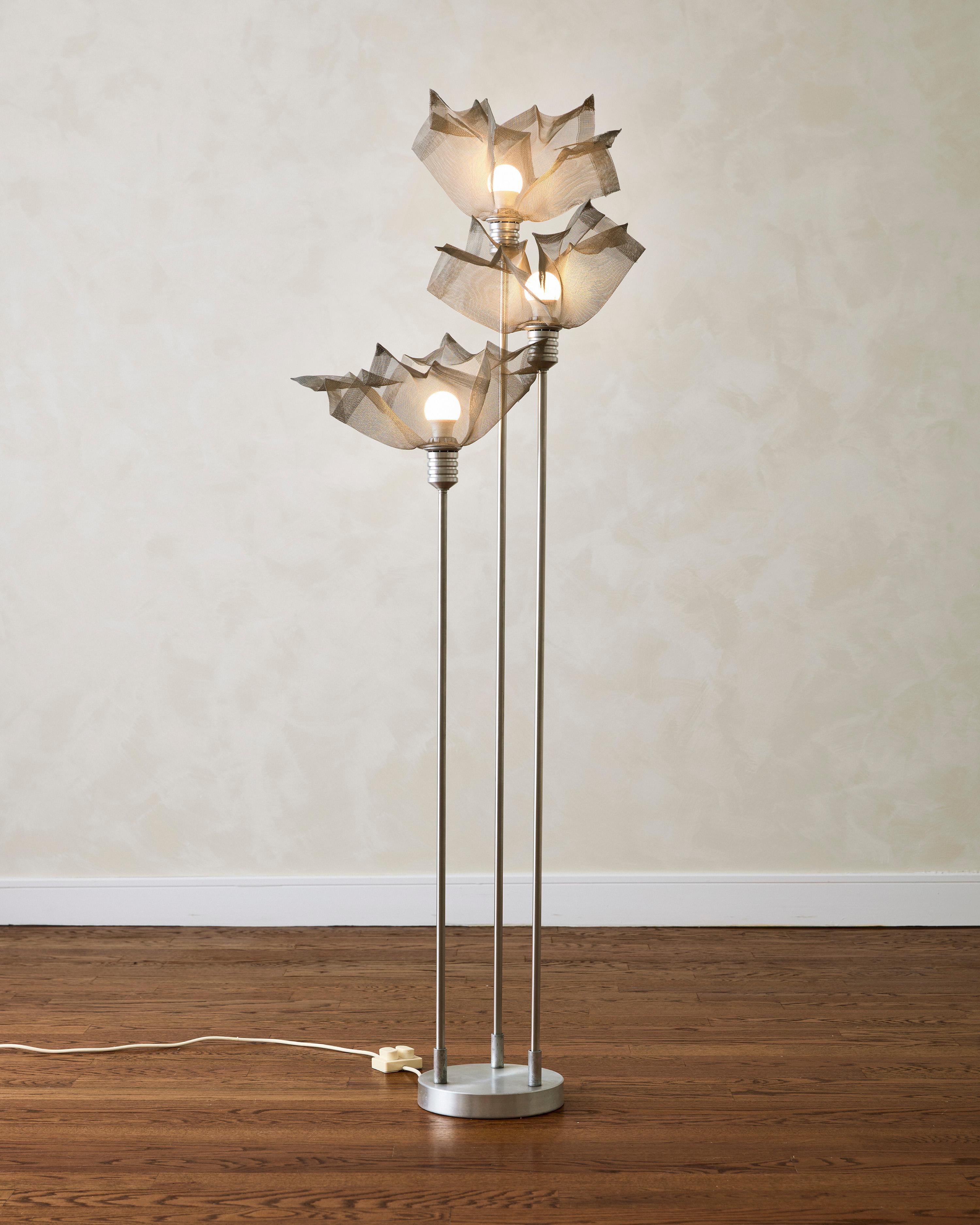 Threes-shade Floor Lamp Attributed to Giuseppe Raimondi. The aluminum structure is complemented by three sculptural lampshades in metal mesh, to create a floral-inspired composition.

