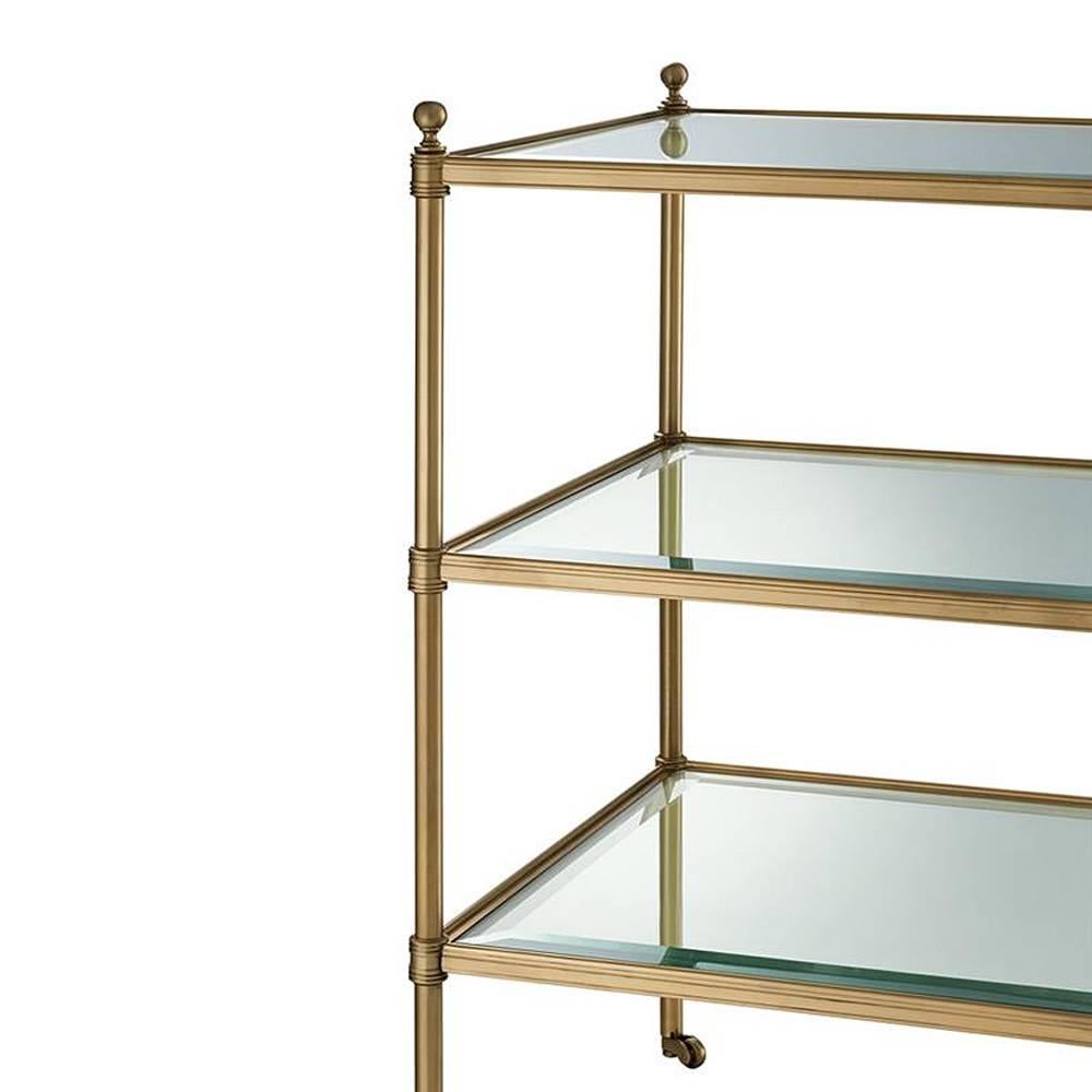 Side table three shelves with structure in aged brass
and with three shelves in bevelled clear glass.
Also available in silver plated finish.