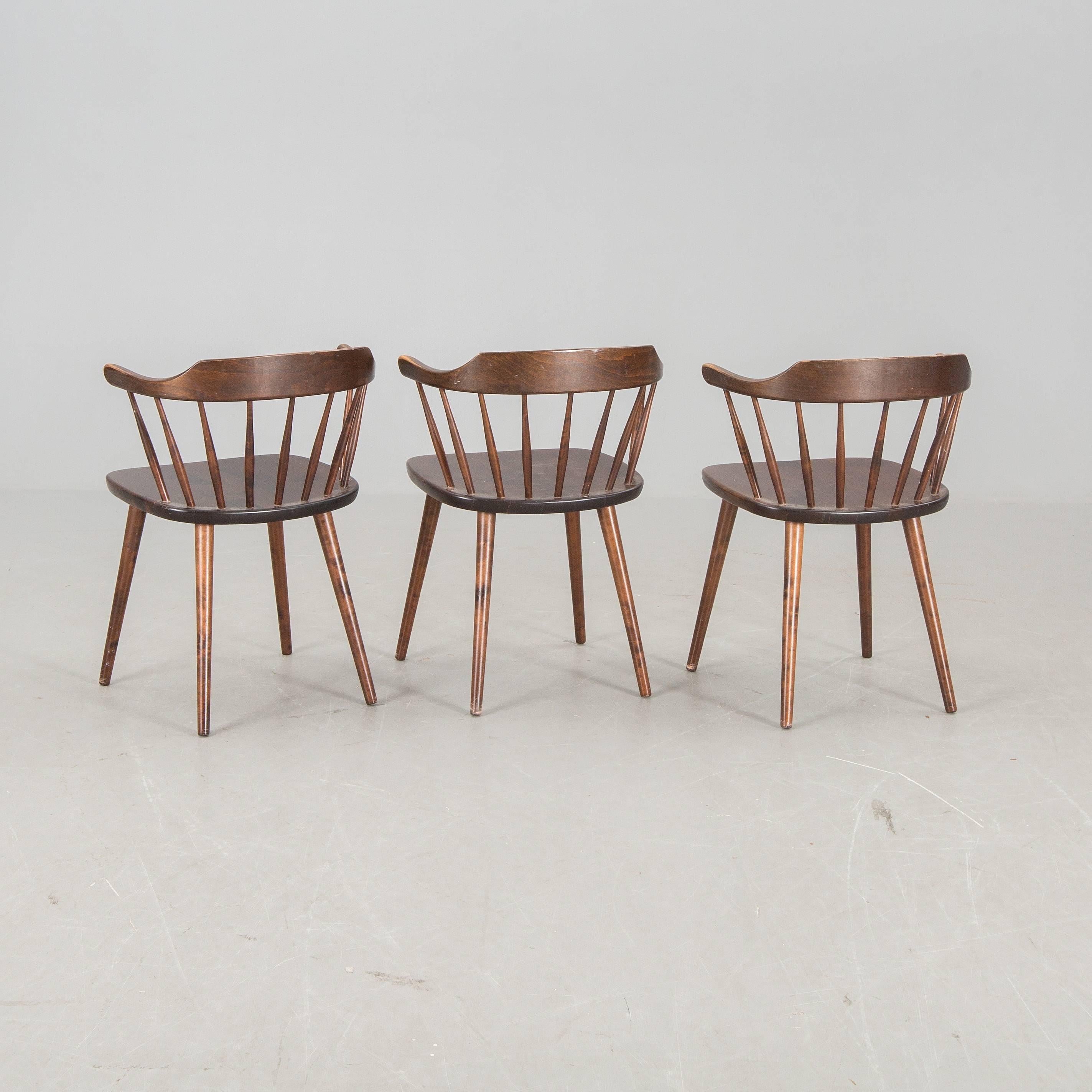 Chairs by Yngve Ekström with armrests. Wood.